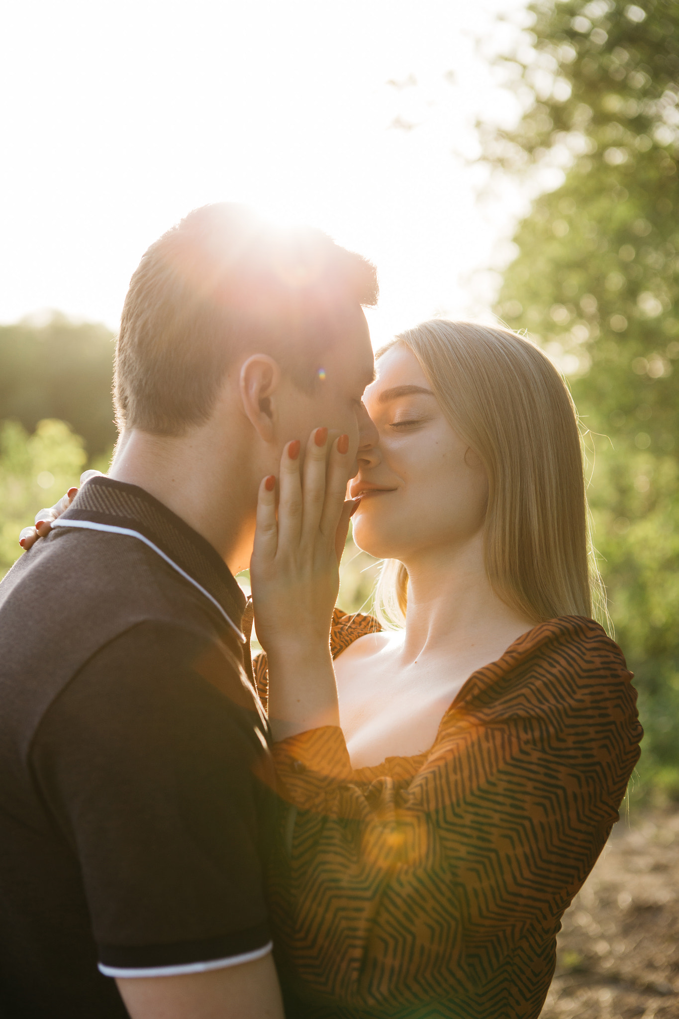young couple kissing in the park Tver, Russia