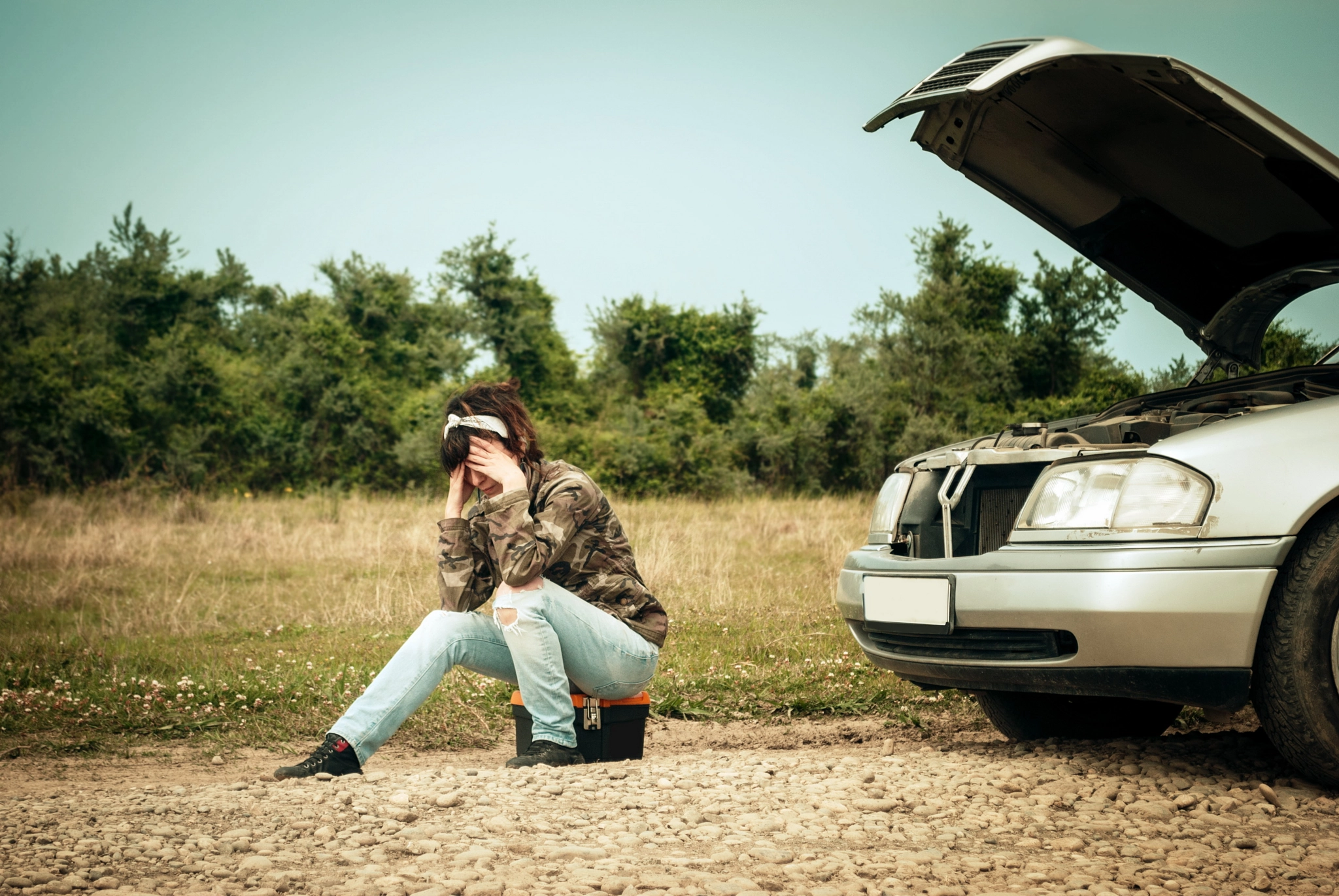 Fashion woman having troubles with the car