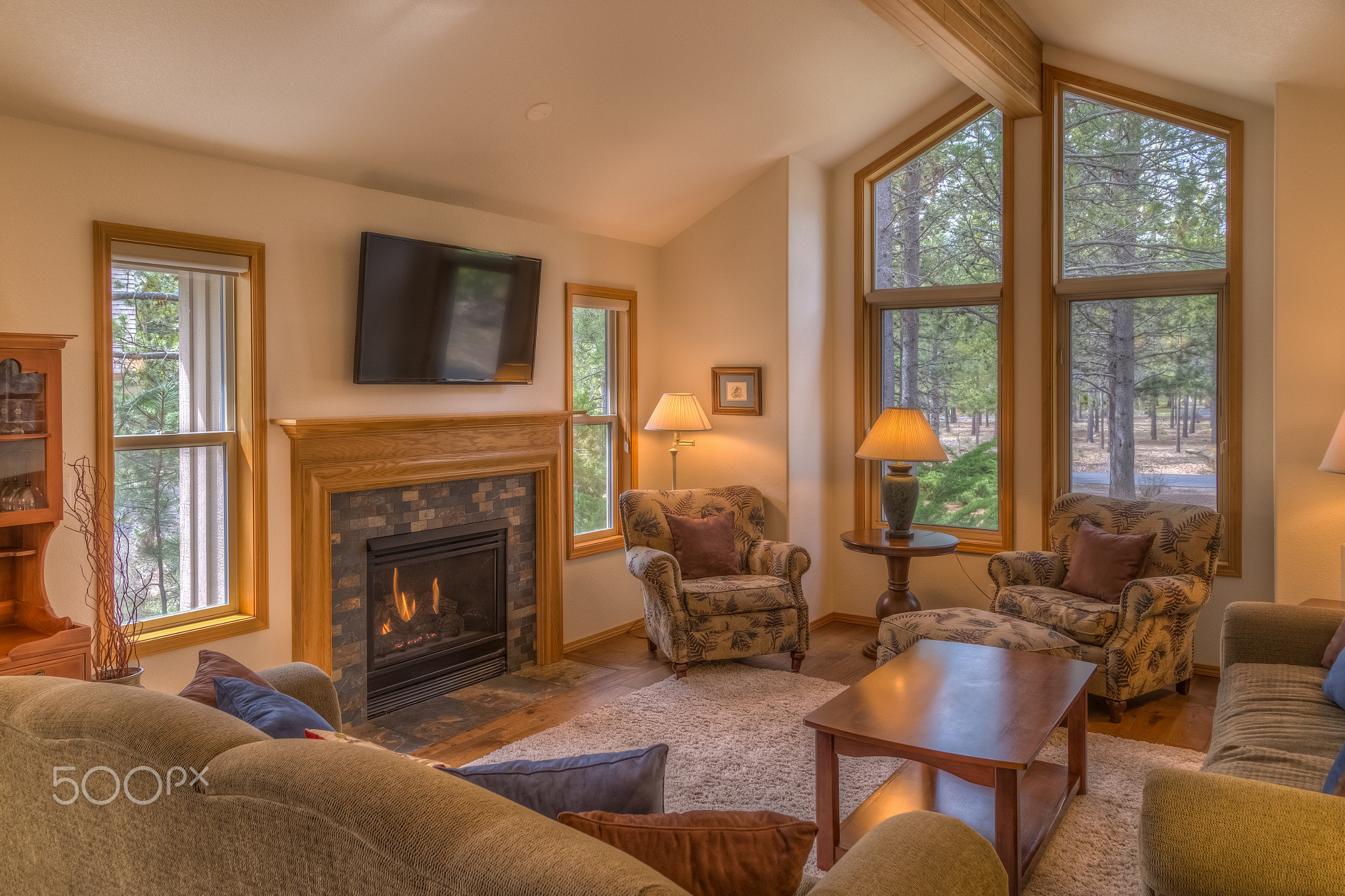 Living room with fireplace and picture windows