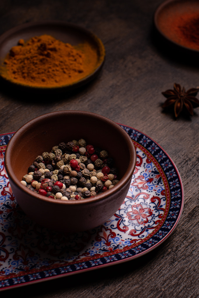 Peppercorns in a ceramic bowl by tmedvedtskaya on 500px.com