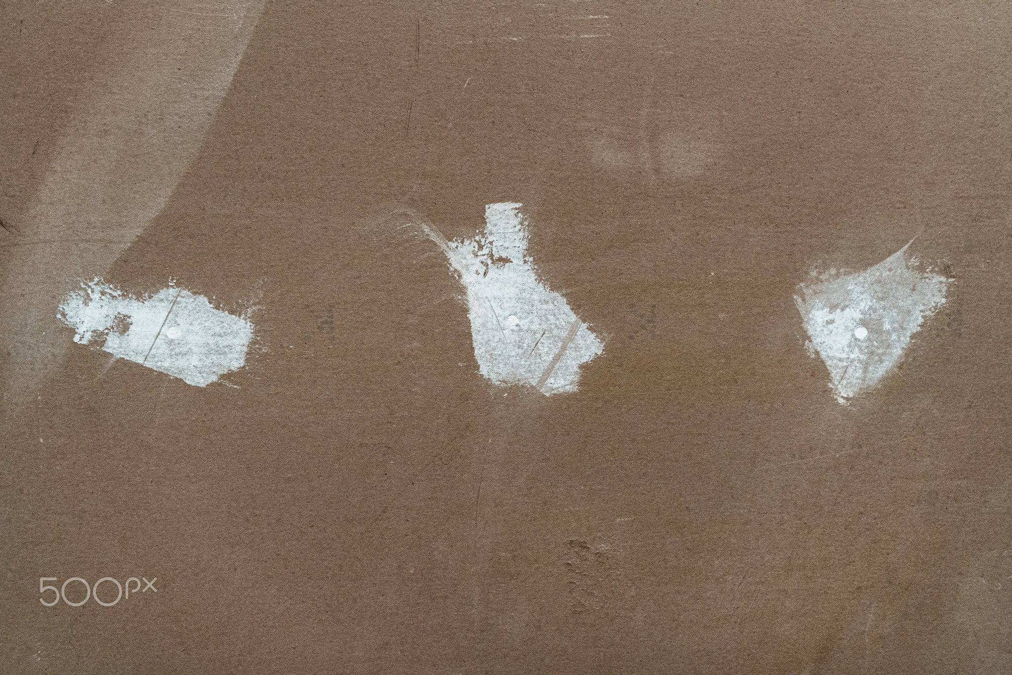 Drywall panel with plastered holes on it. White putty on drywall