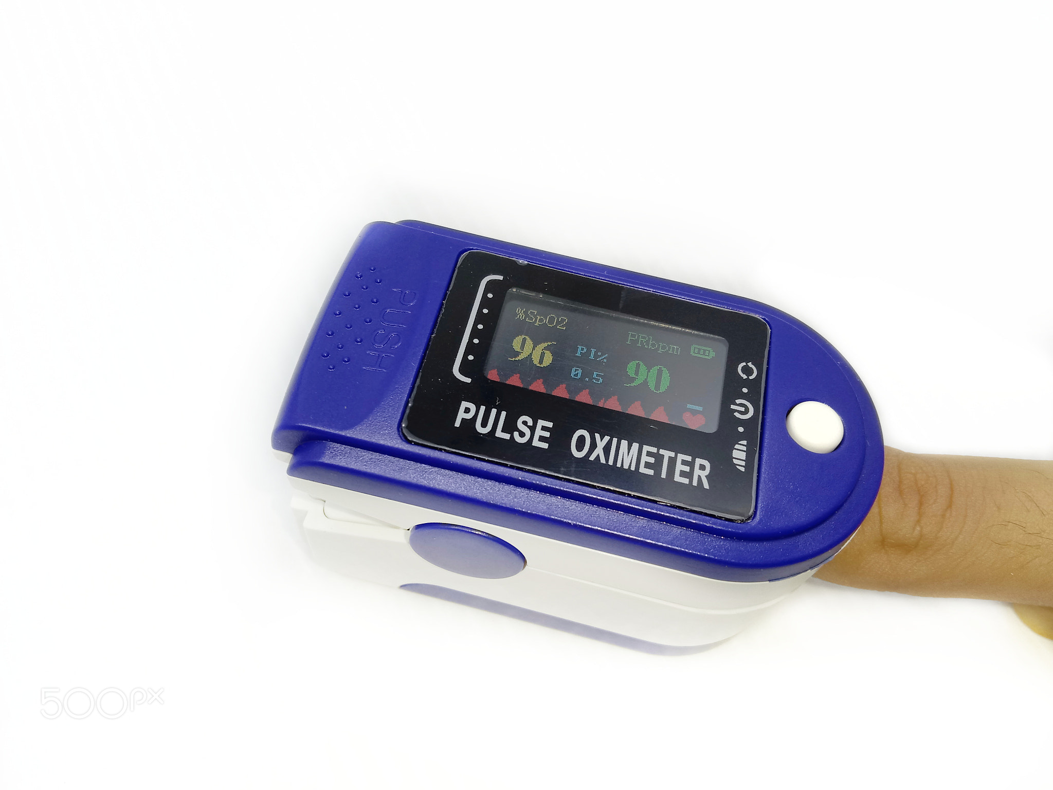 Man using pulse oximeter on his fingertip