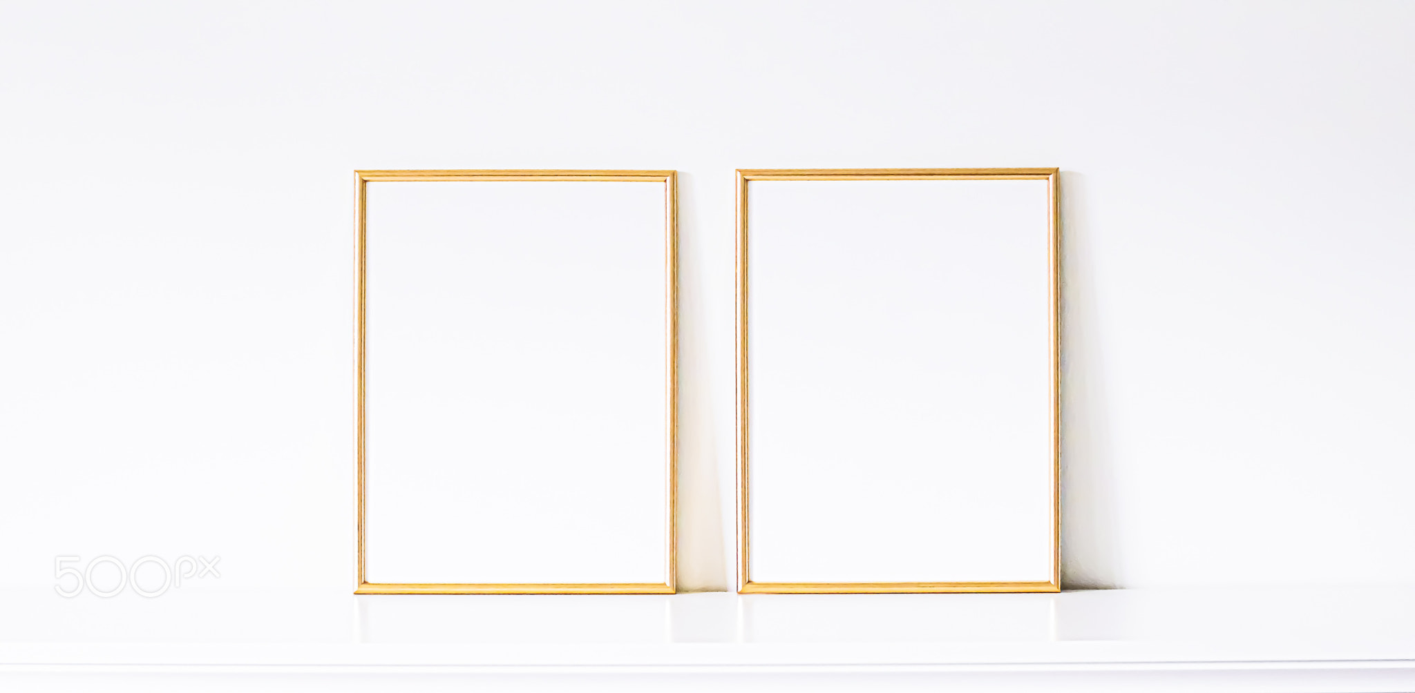 Golden frame on white furniture, luxury home decor and design for