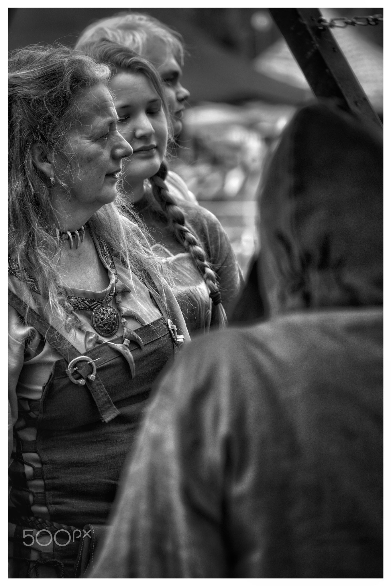 A noble viking woman with her maids in the market