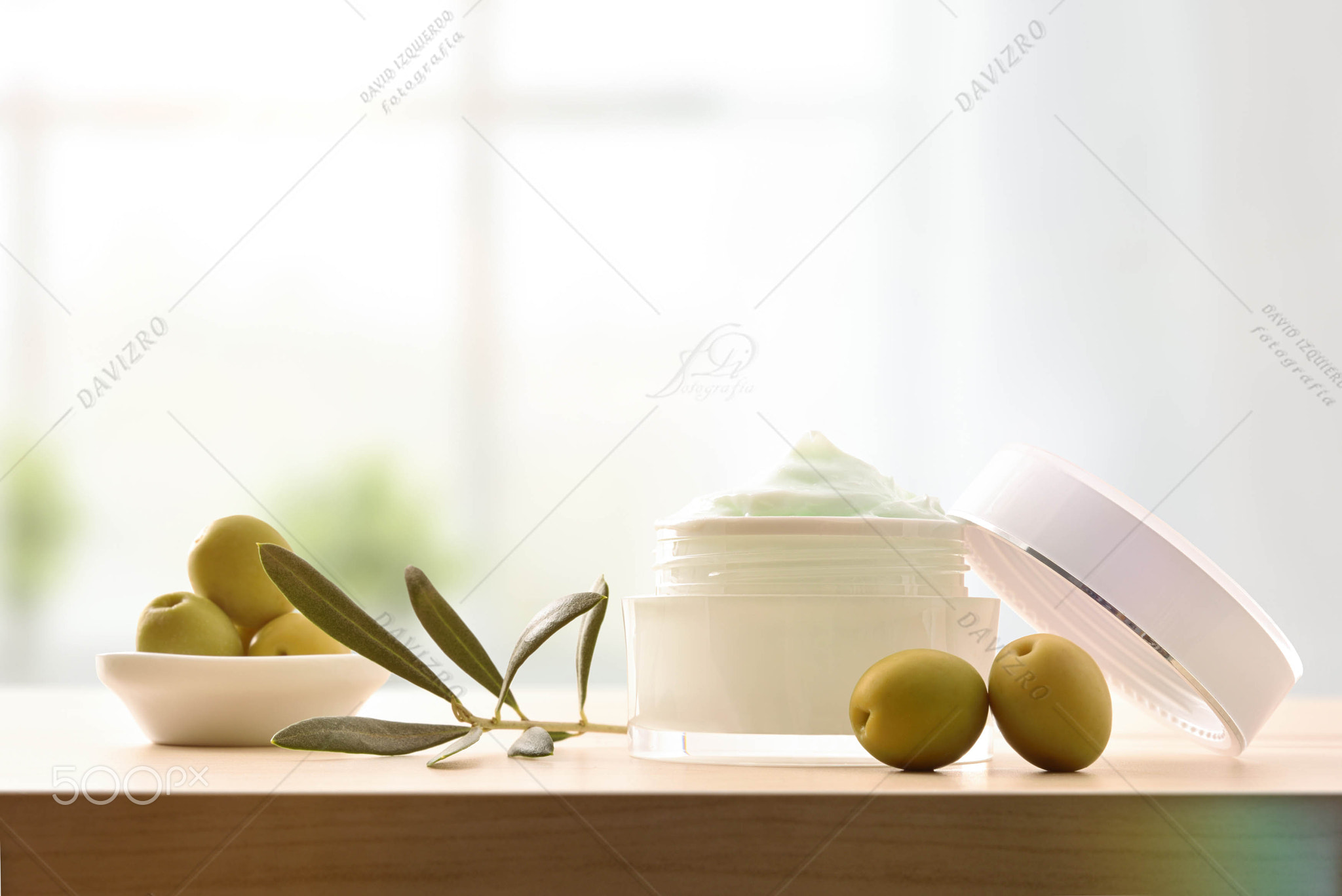 Moisturizing cosmetic cream with olive extract for skin in room