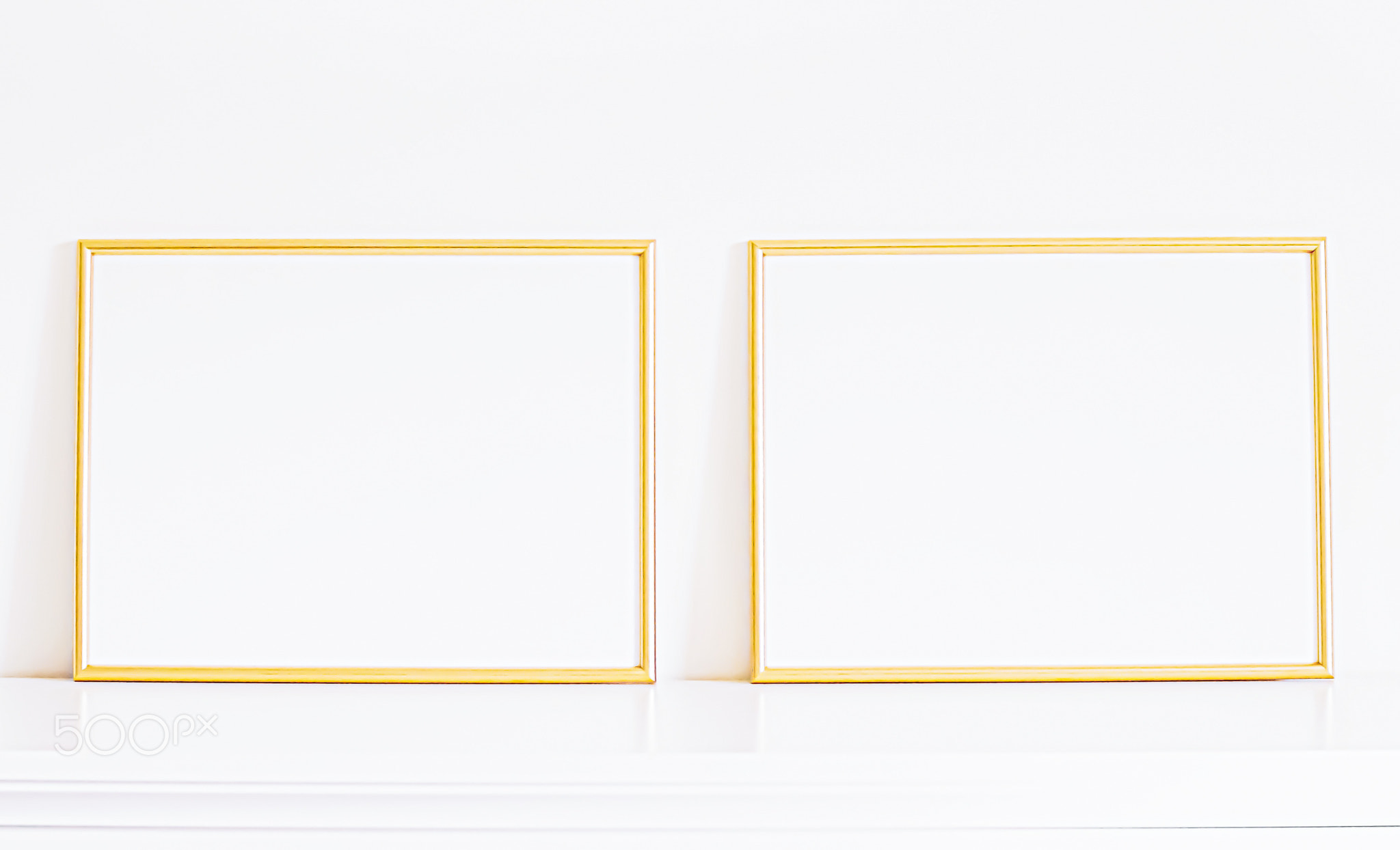 Golden frame on white furniture, luxury home decor and design for