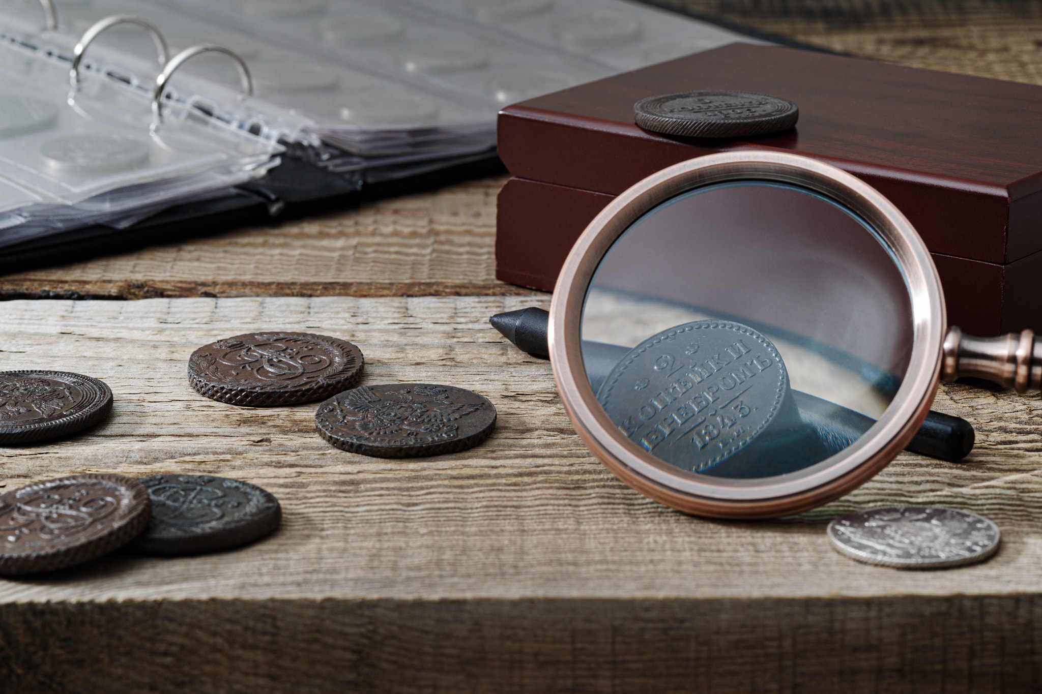 Numismatics. Old collectible coins on a wooden table.