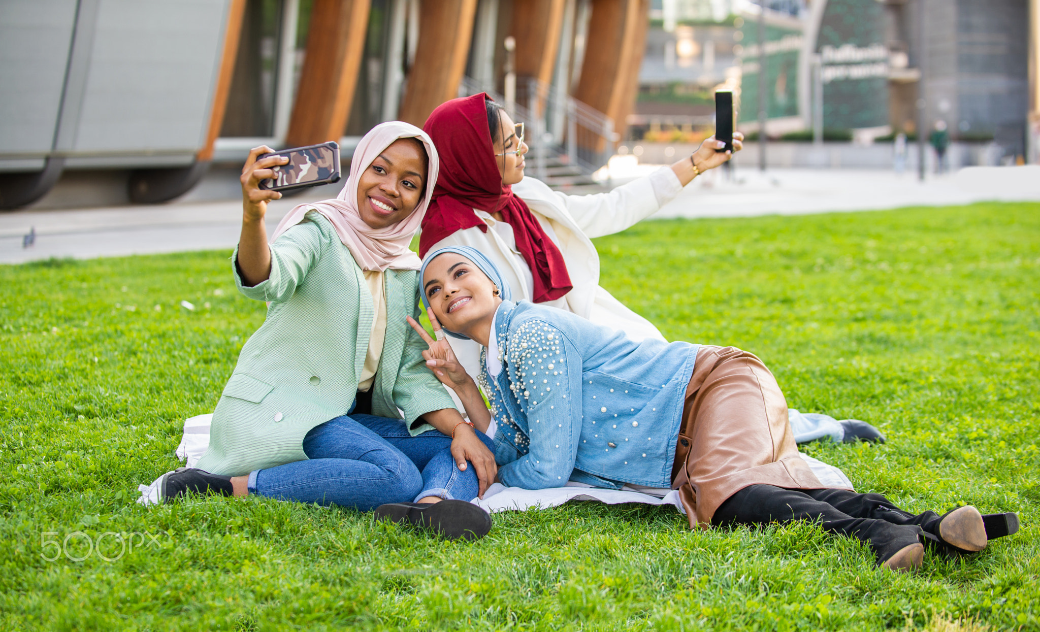 Beautiful muslim girl wearing hijab bonding outdoors