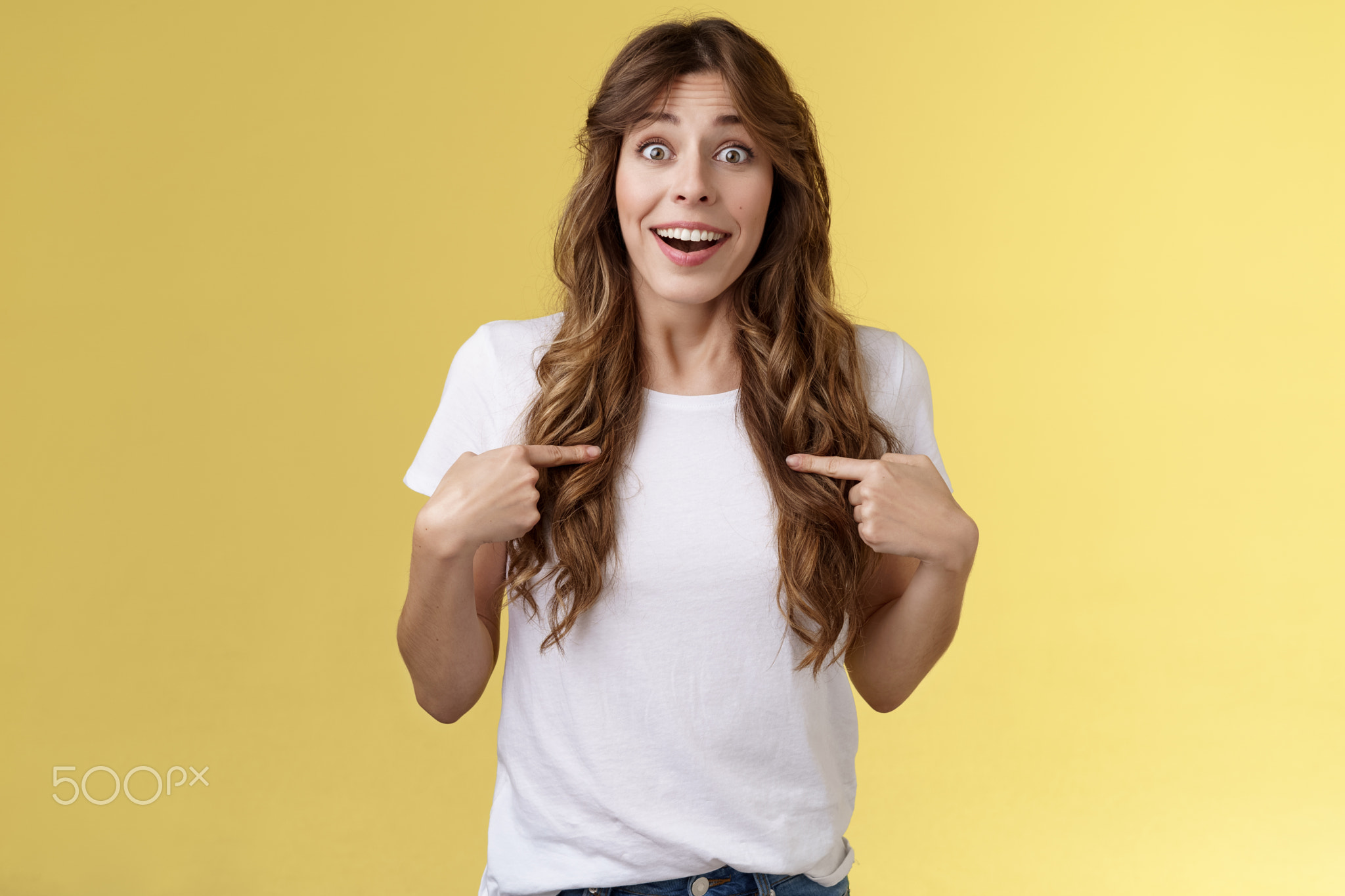 Surprised relieved pleased cute curly-haired girl receive promotion