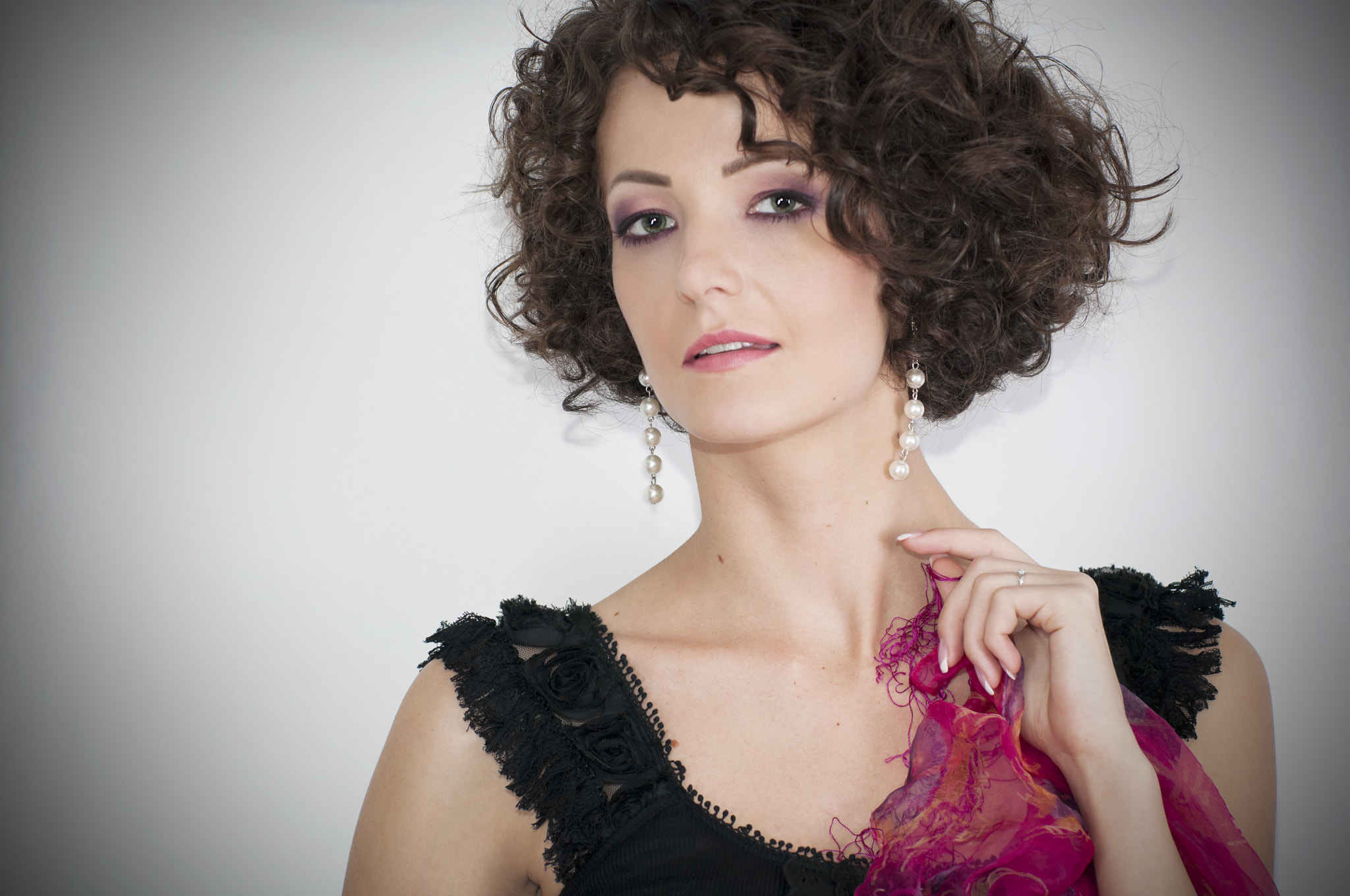 Beautiful curly brunette with colored scarf