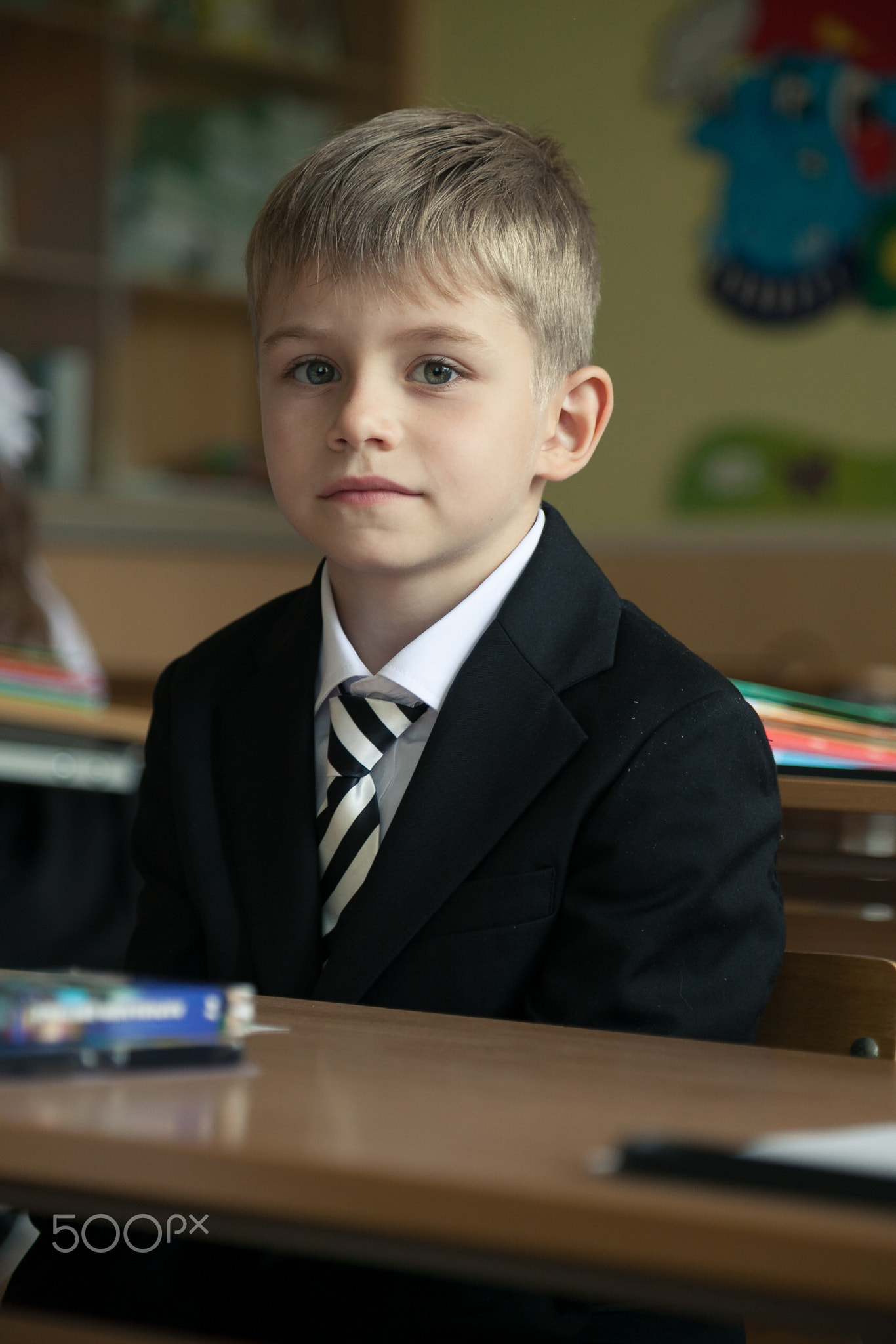 The boy came to school for the first time. Back to school