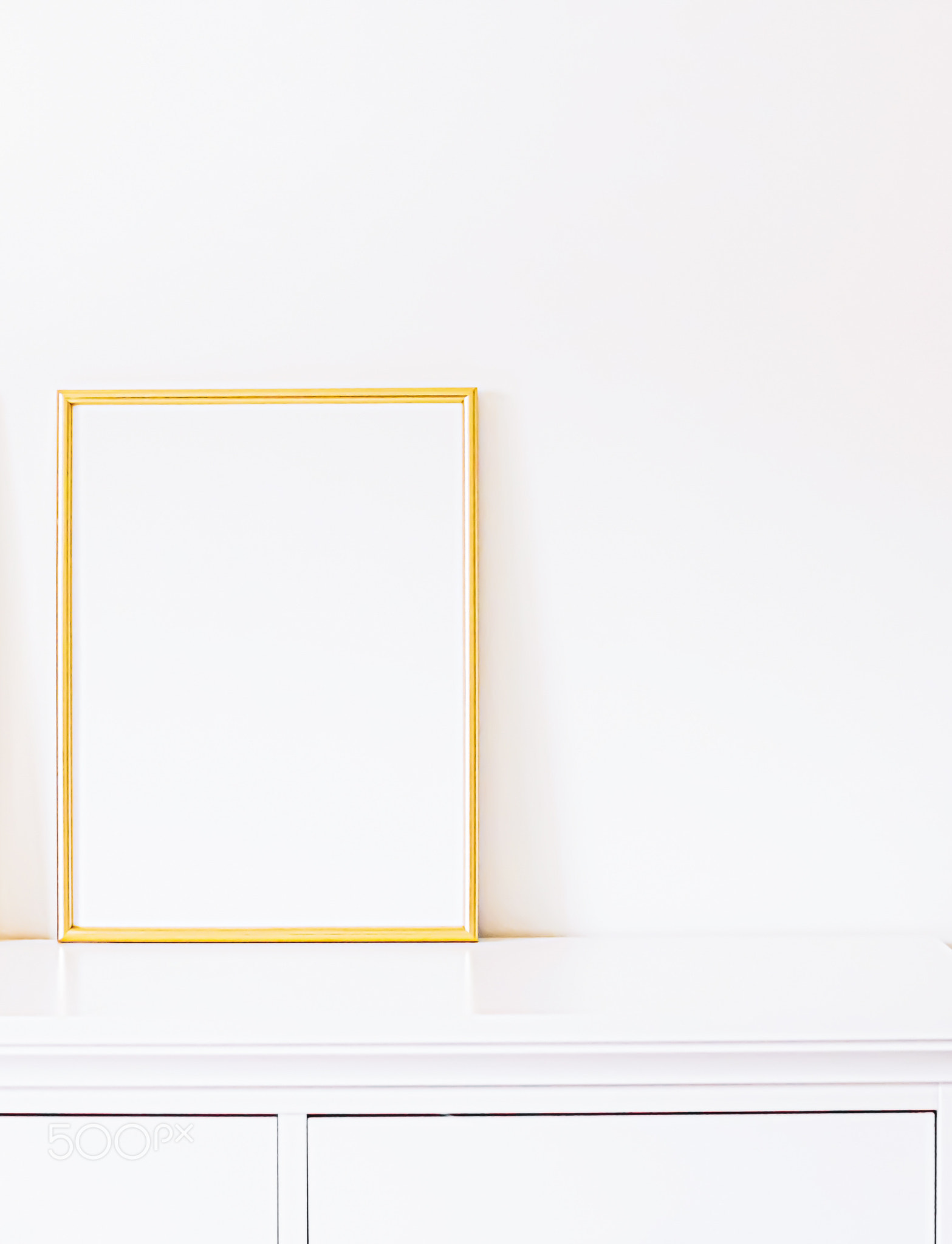 Golden frame on white furniture, luxury home decor and design for