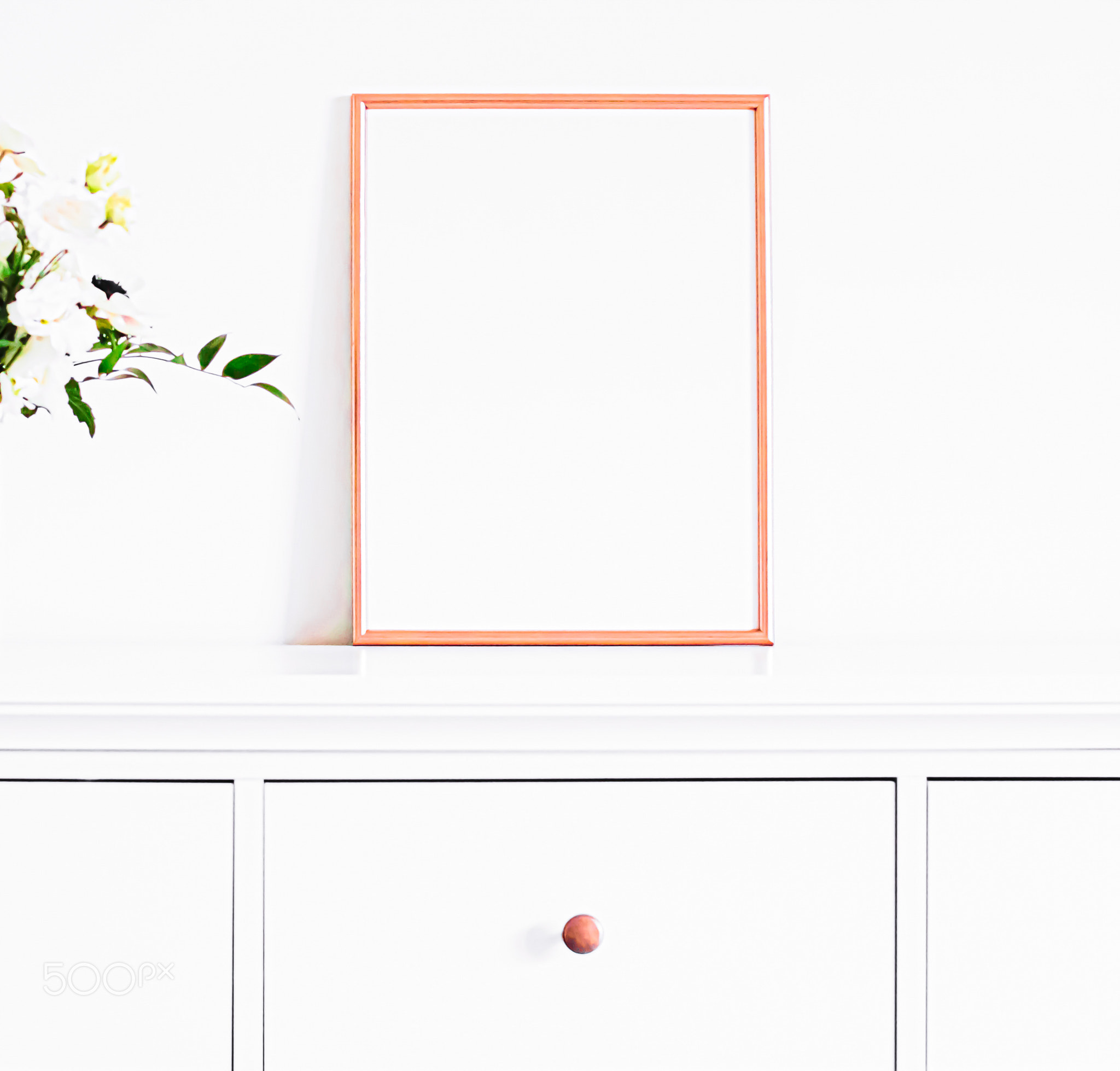 Rose gold frame on white furniture, luxury home decor and design for