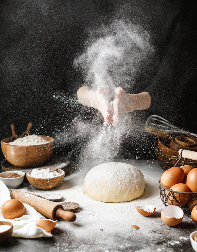Yeast dough on the table with ingredients for cooking bread by Kristina Shavratskaya on 500px.com