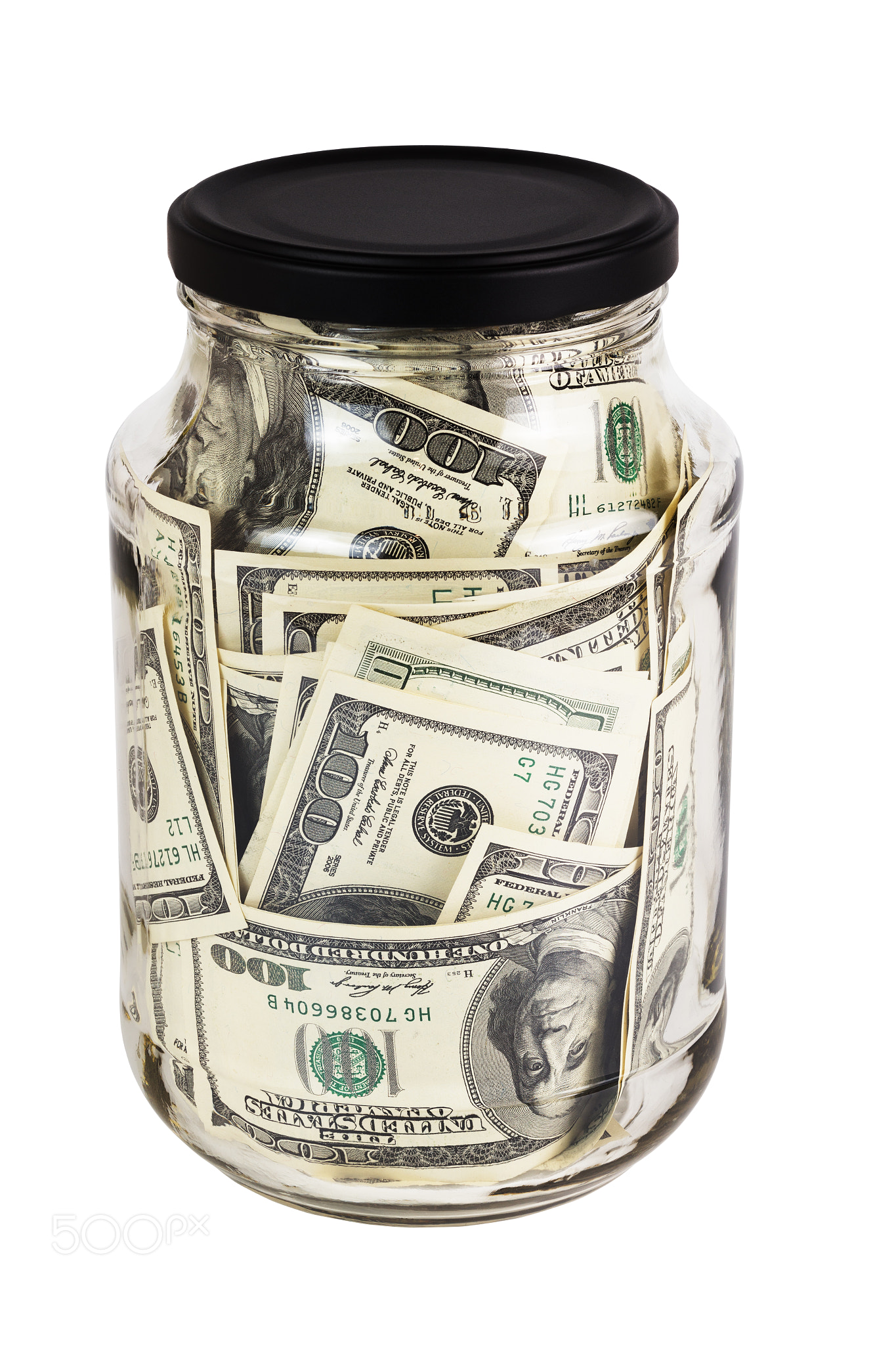 A hundred US dollars bank notes in a glass jar with black cap isolated