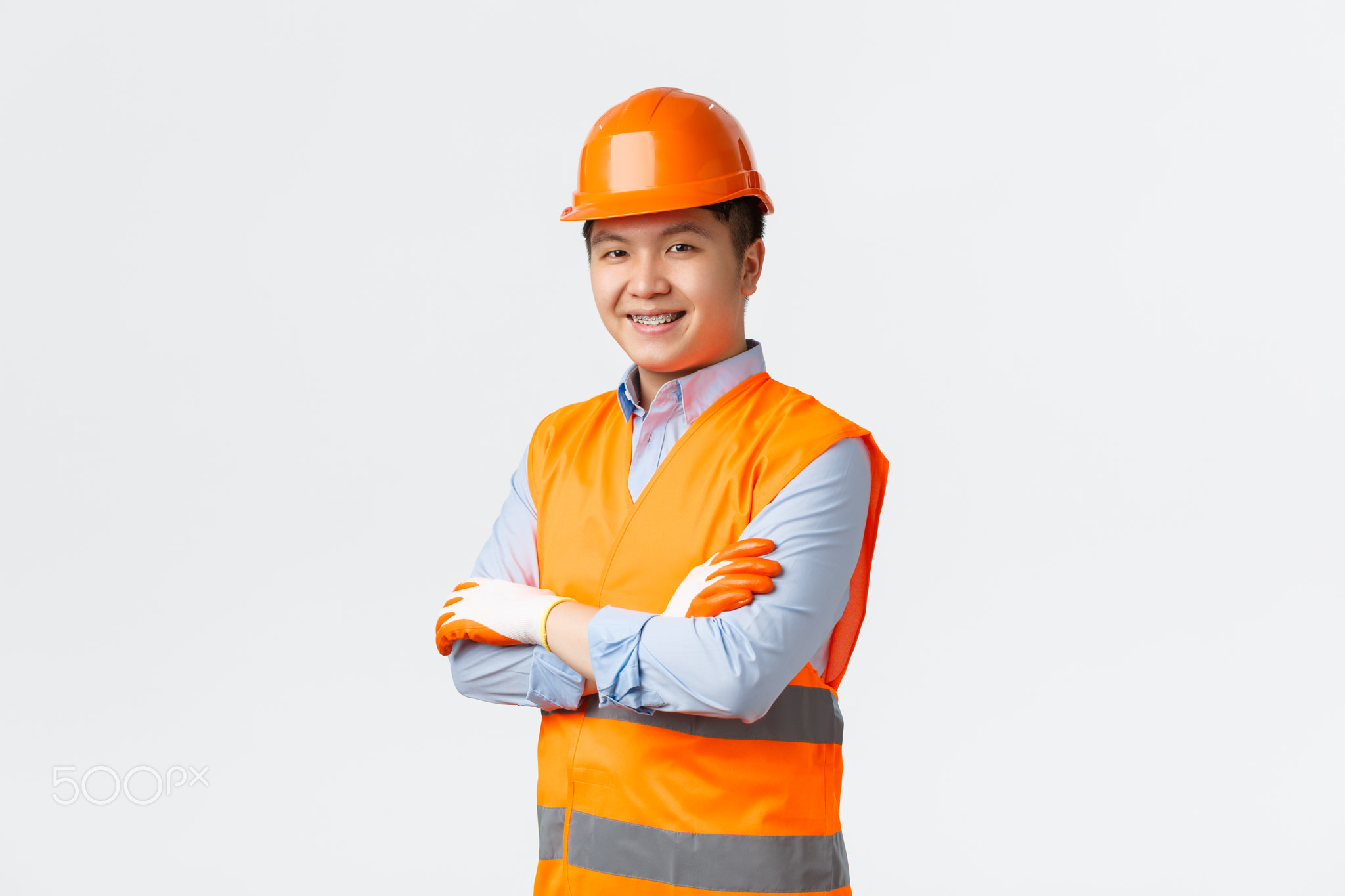 Building sector and industrial workers concept. Confident young asian