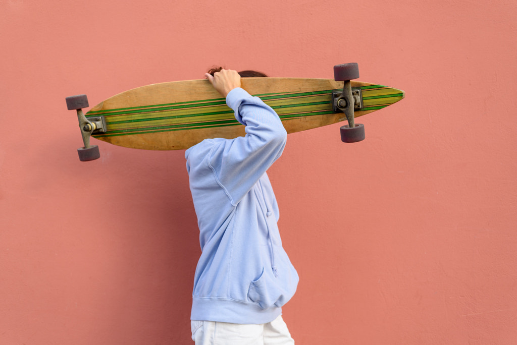 Woman holding longboard by Tatyana Aksenova on 500px.com