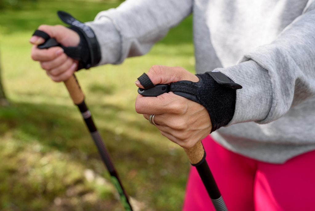 Woman holding poles for nordic walking by Tatyana Aksenova on 500px.com