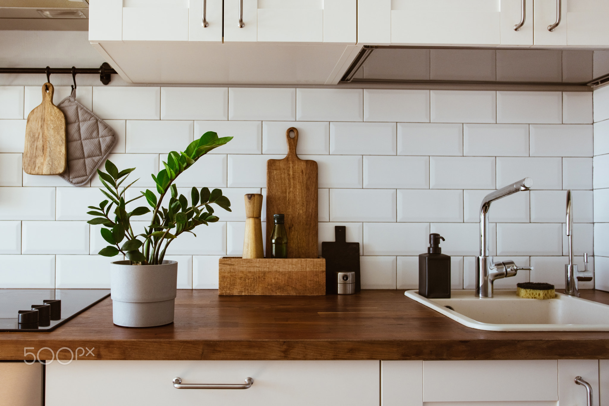 Kitchen brass utensils, chef accessories. Hanging kitchen with white