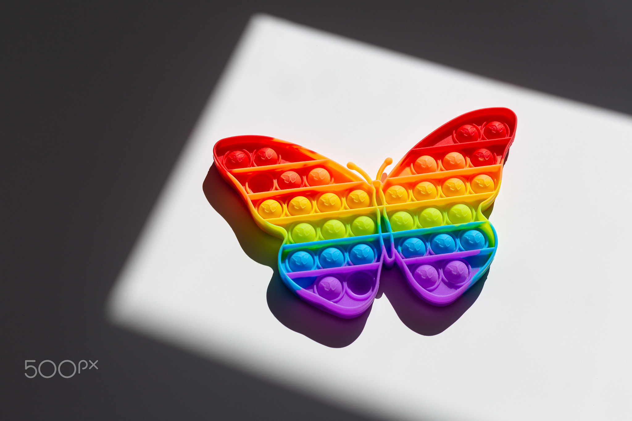 Rainbow butterfly. Lgbt flag symbol concept. Children's toy Pop It..