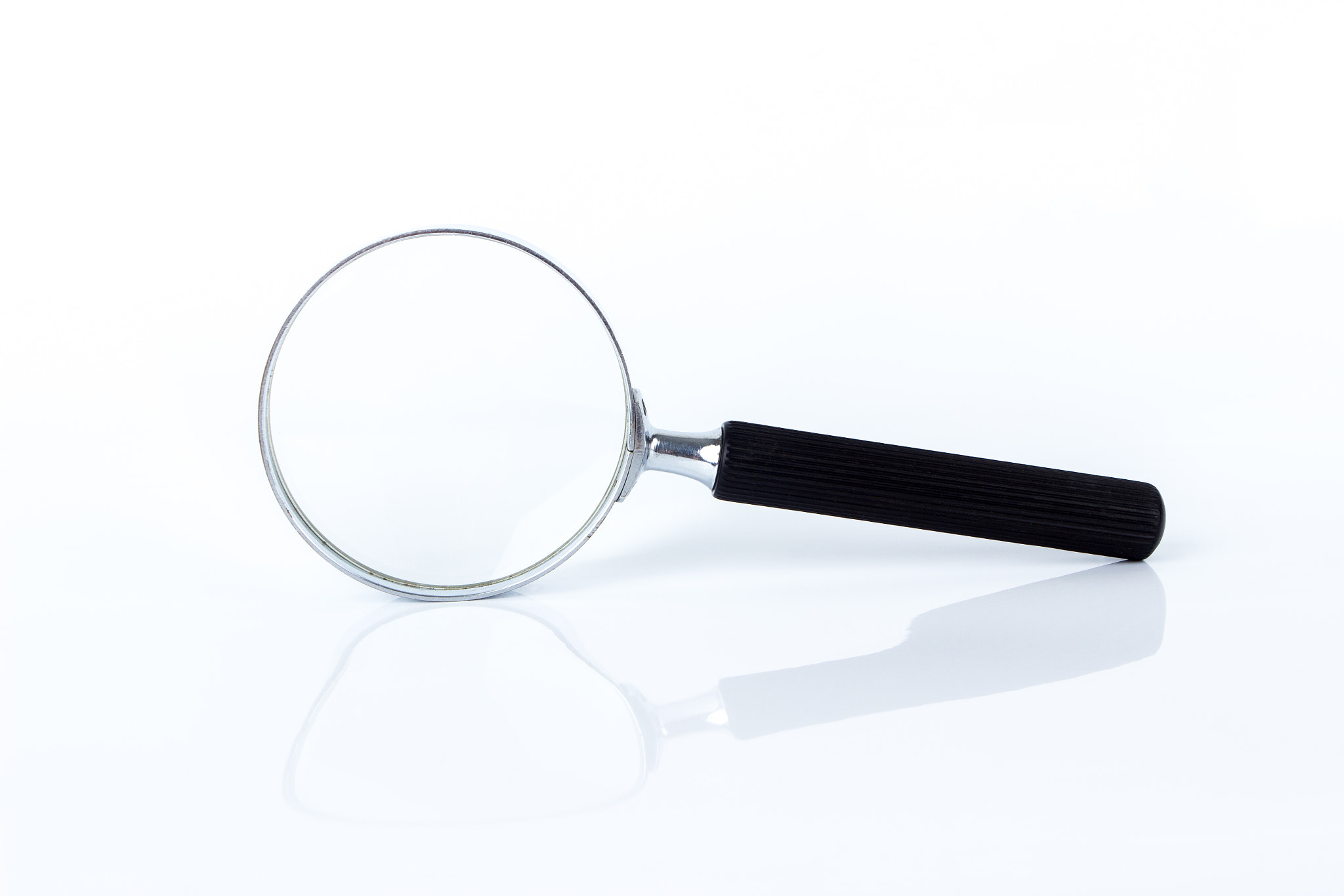 Magnifying glass on the white background