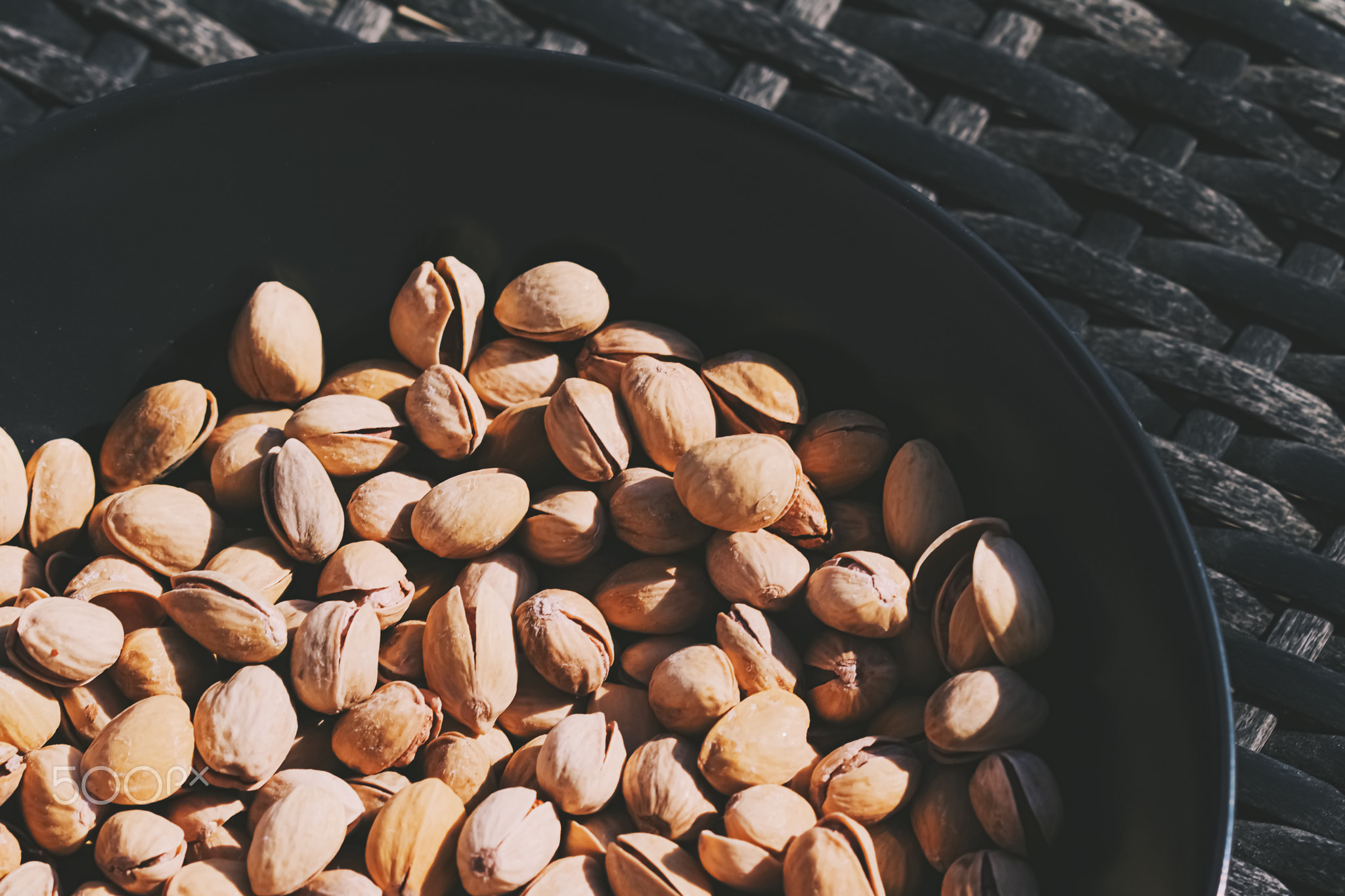 Organic pistachios in the sun, healthy food and snack background