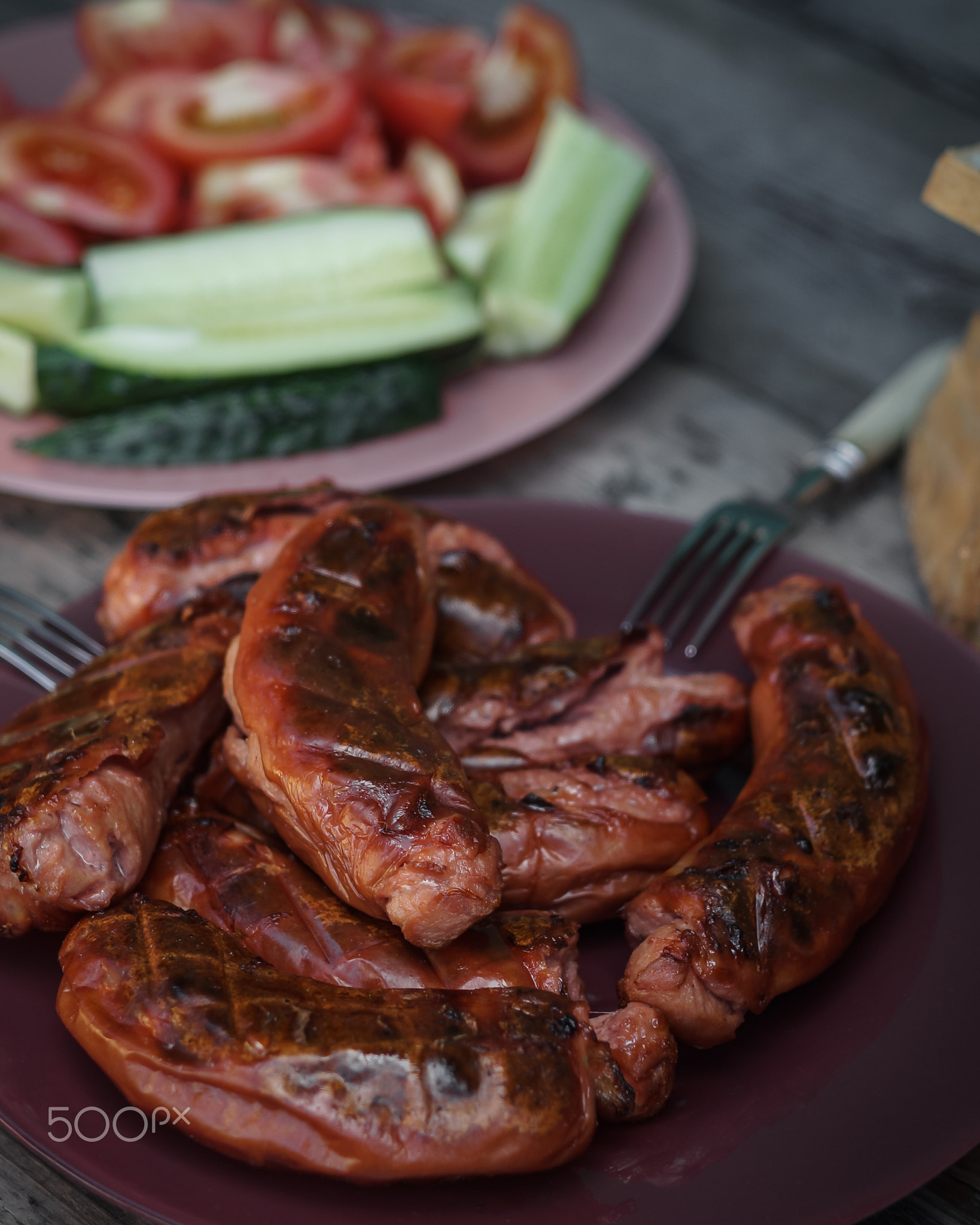 Hot sausages with grill close-up. Serving option with cutting