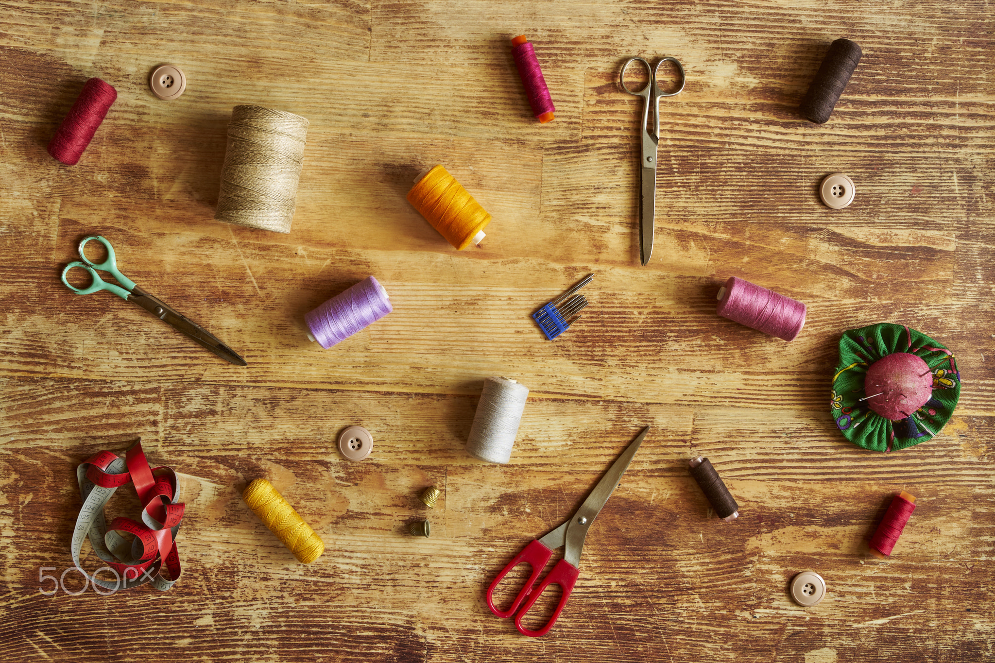 Sewing supplies on a wooden table no2