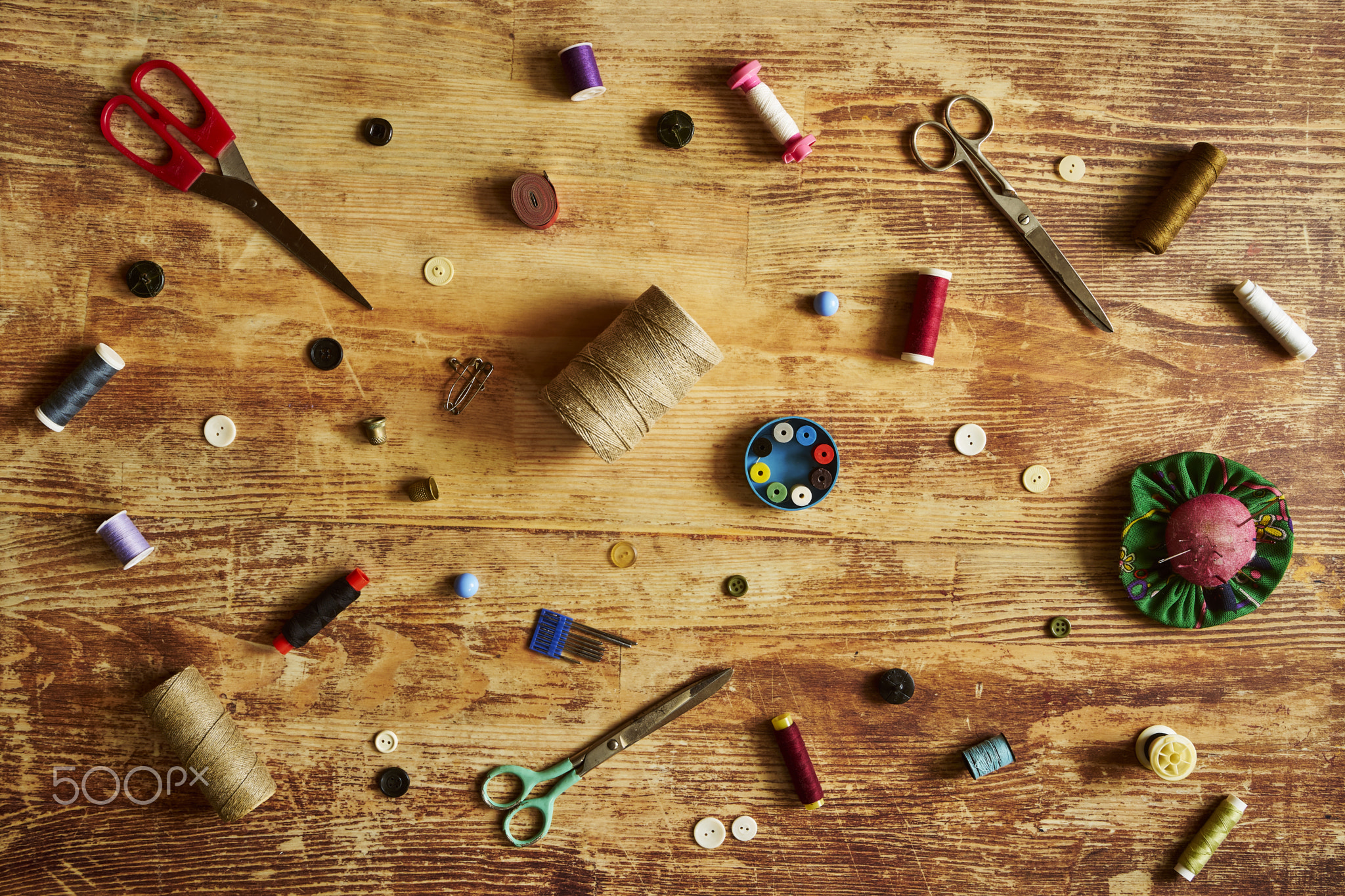 Sewing supplies on a wooden table no1