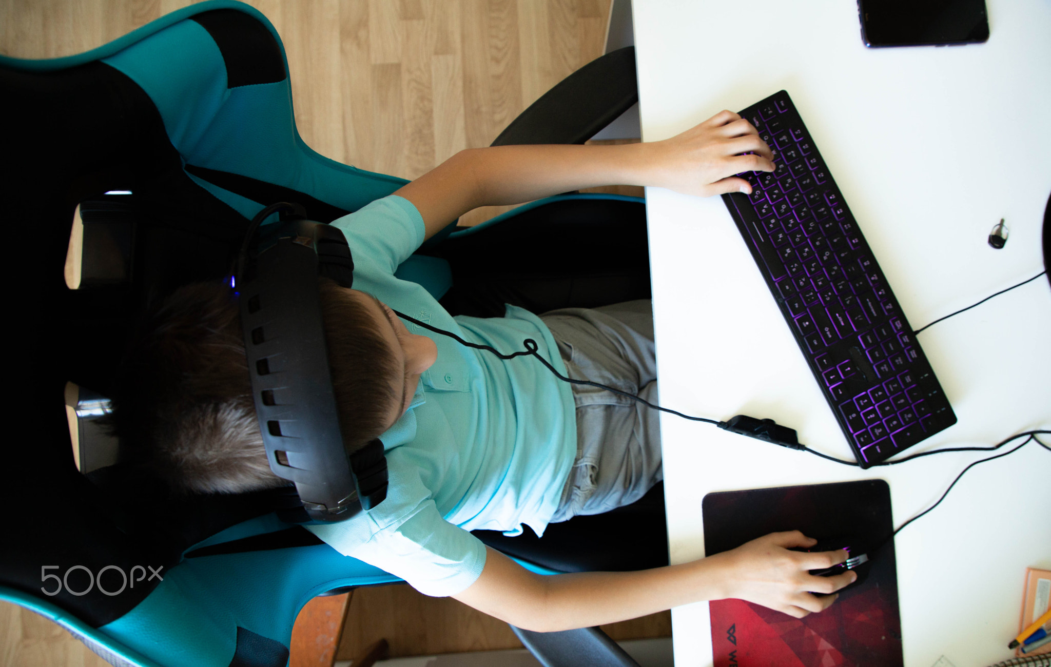 a boy plays in computer game