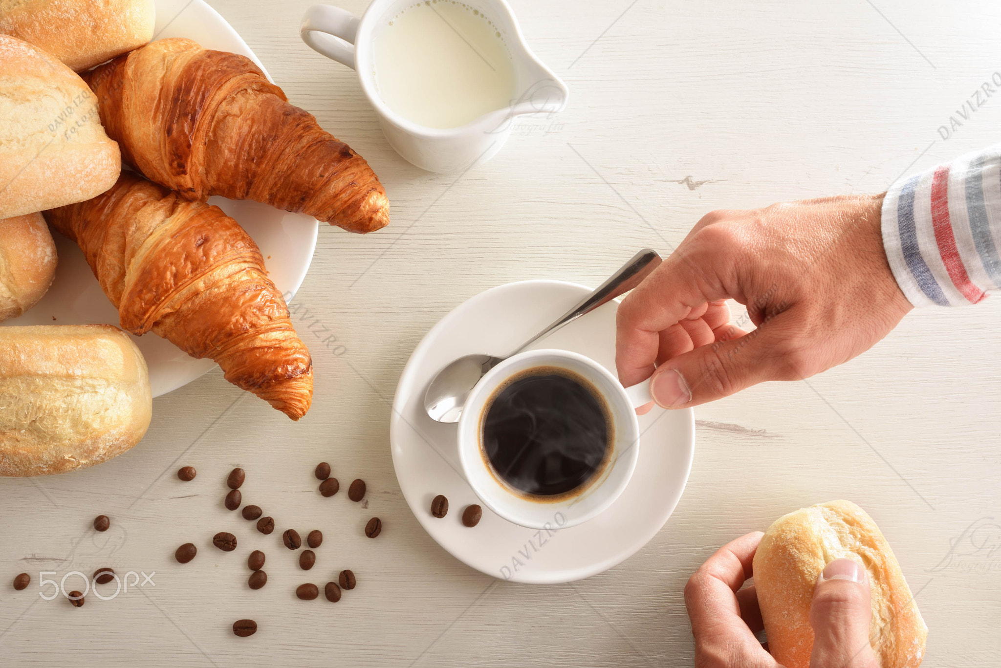 Man having coffee on white breakfast table top