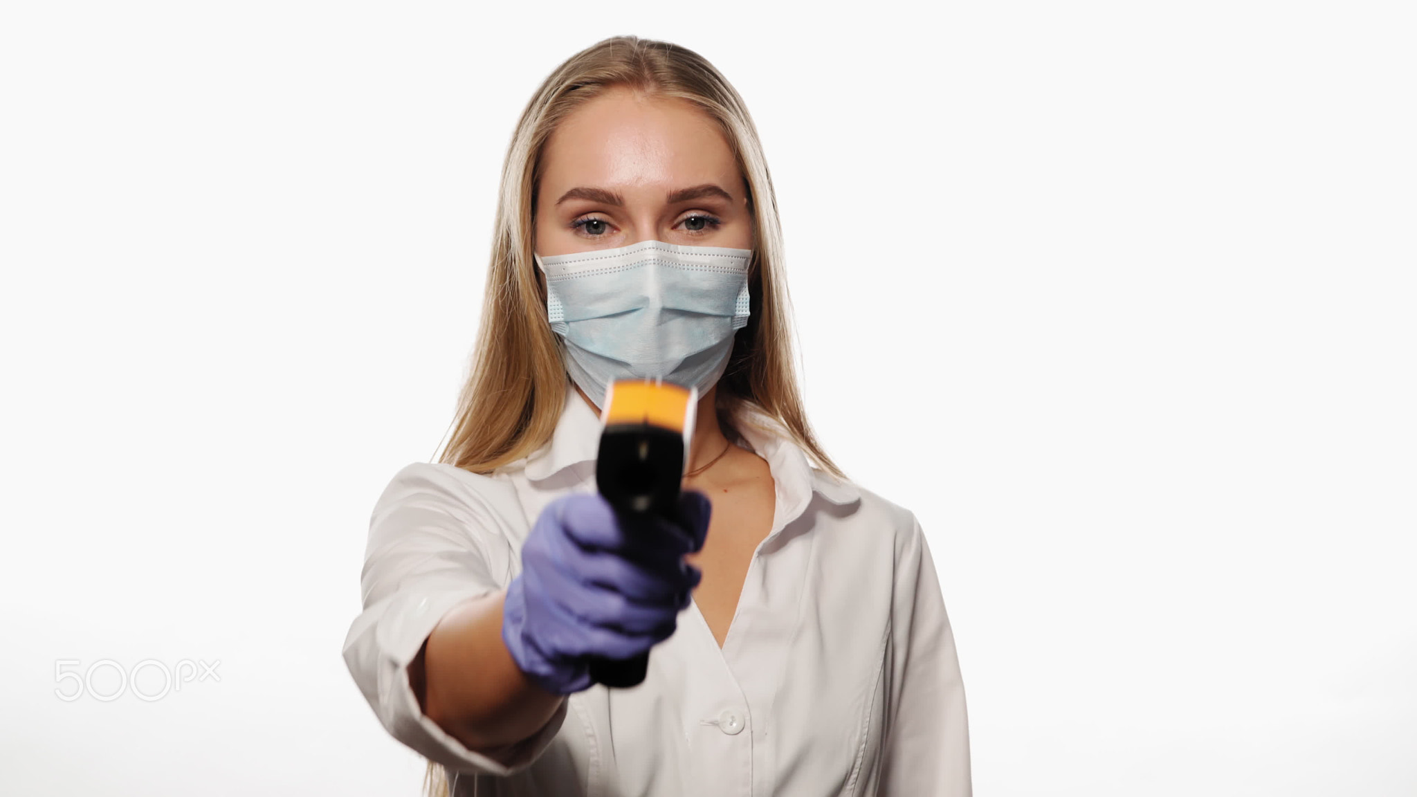 Doctor or nurse pointing sensor thermometer on camera wearing