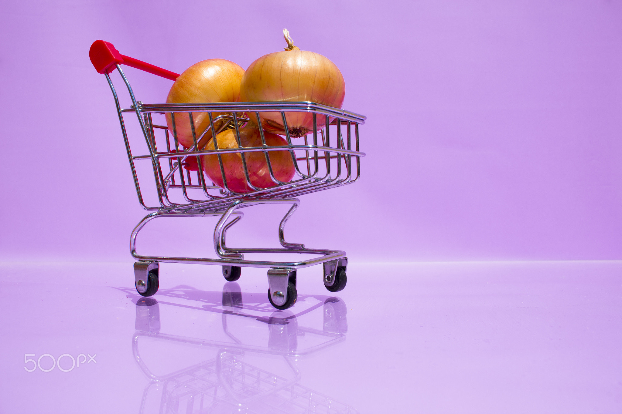 A small shopping cart with three bulbs. 