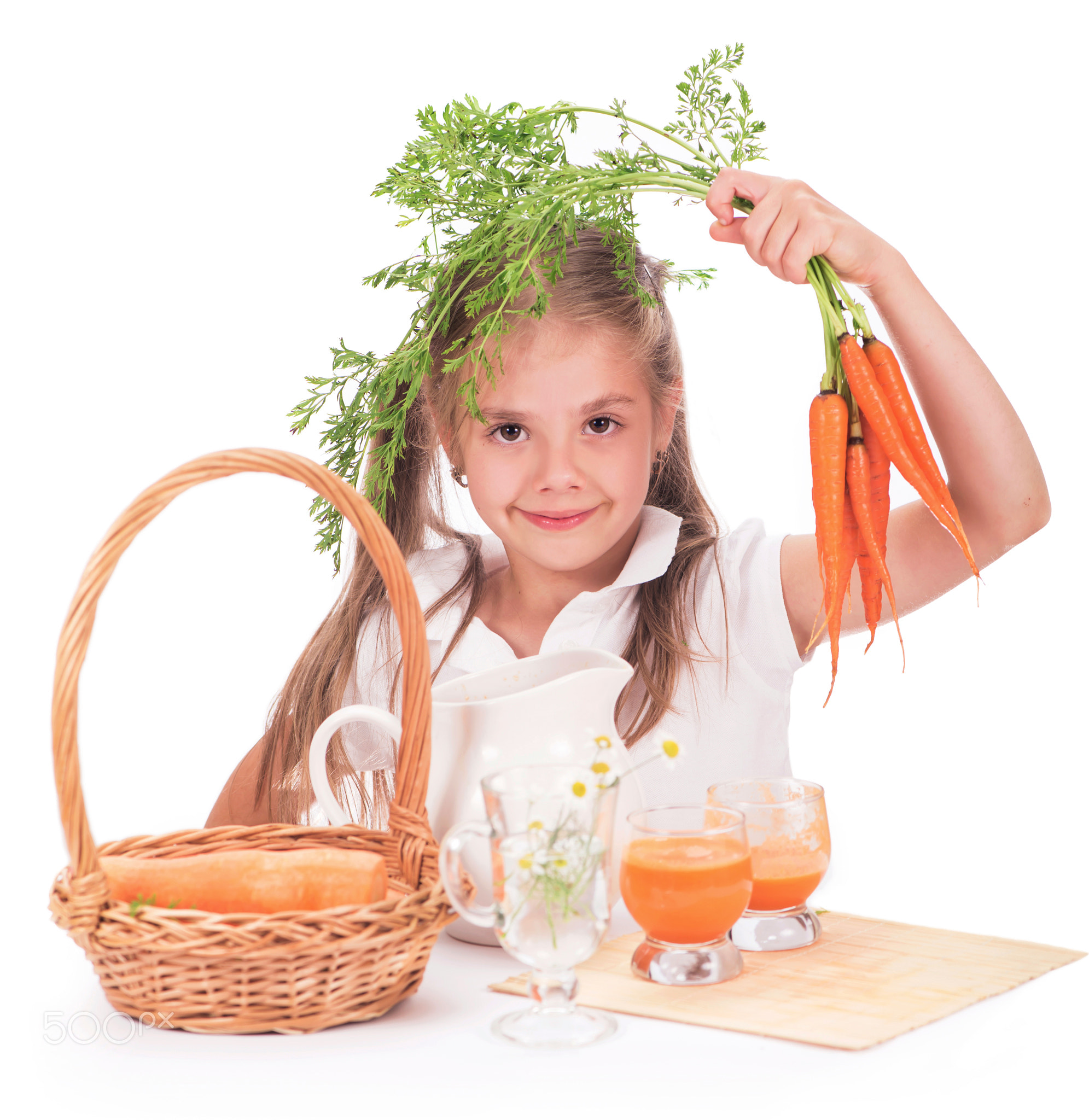 Girl and carrot juice isolated on white background