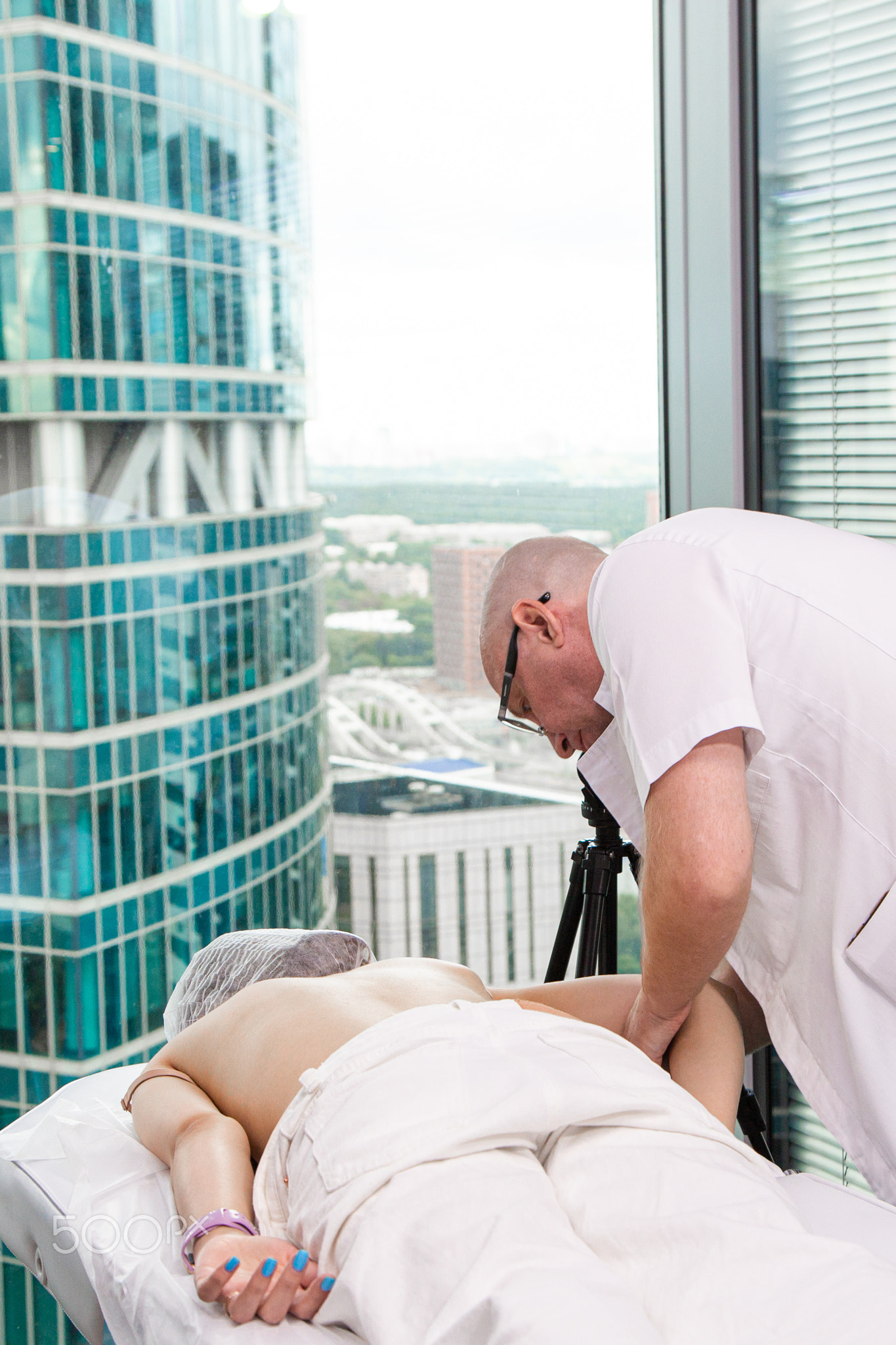Close up of back massage procedure in spa salon
