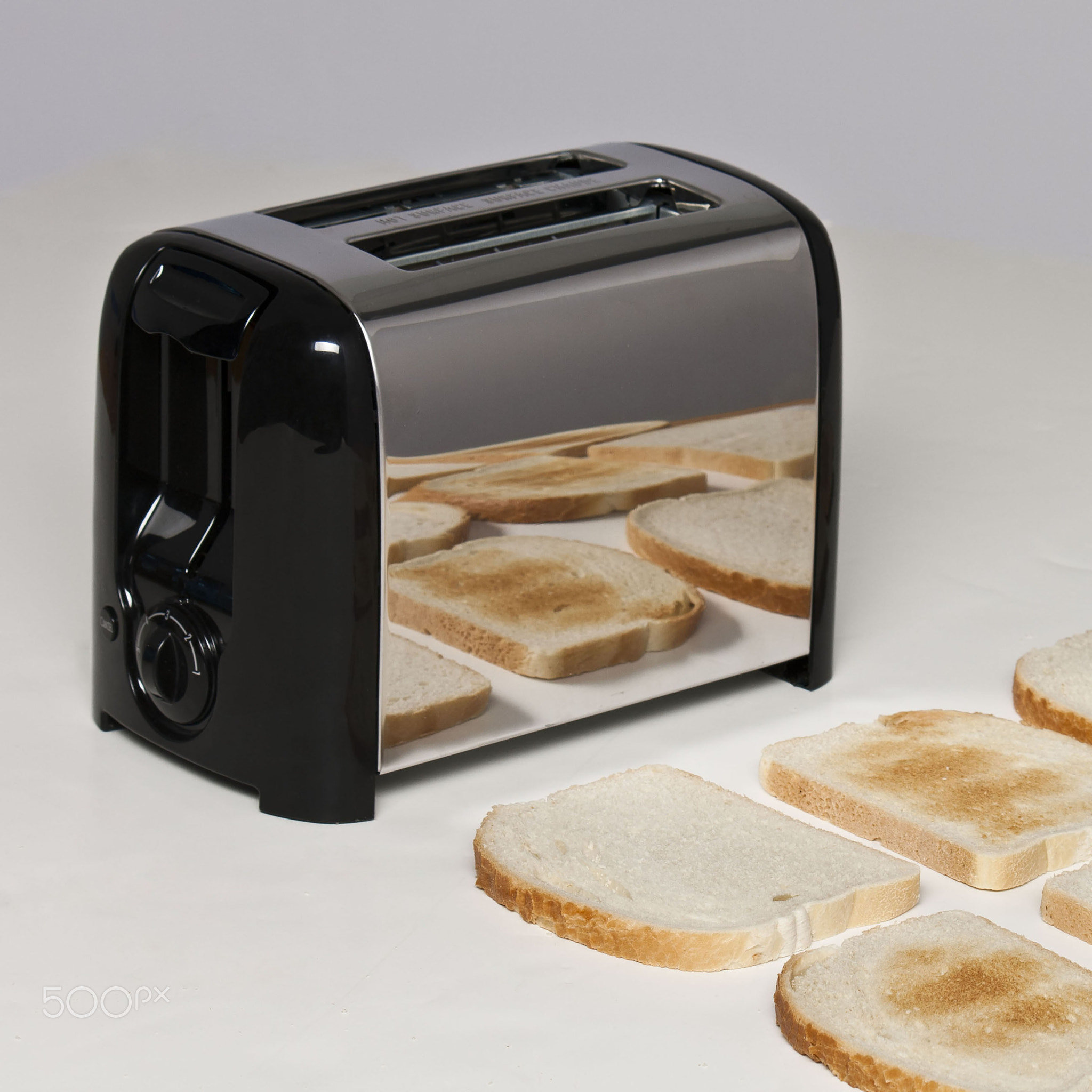 Conceptual image of toaster with bread