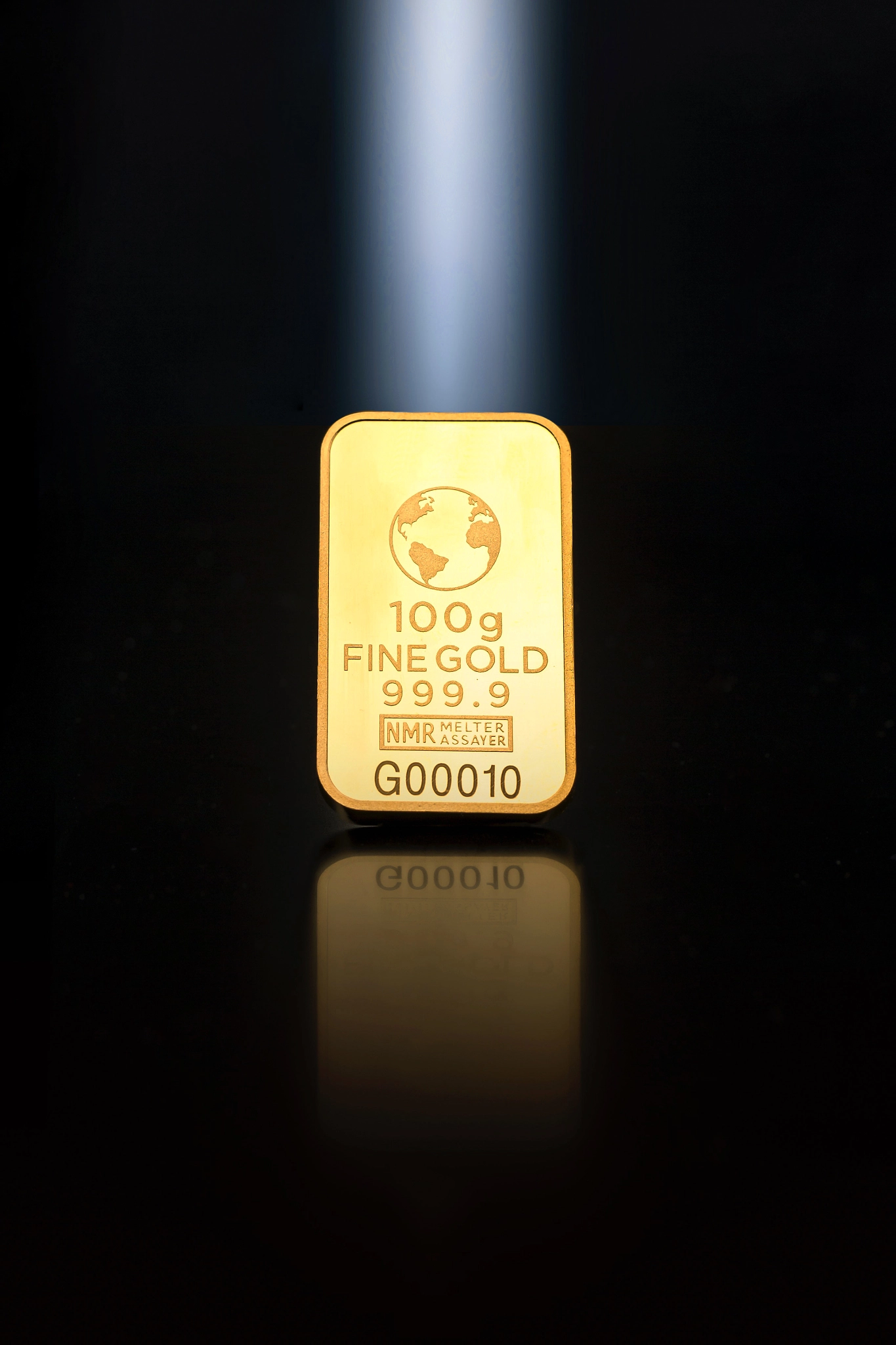 Shiny gold bars on black background. Space for text