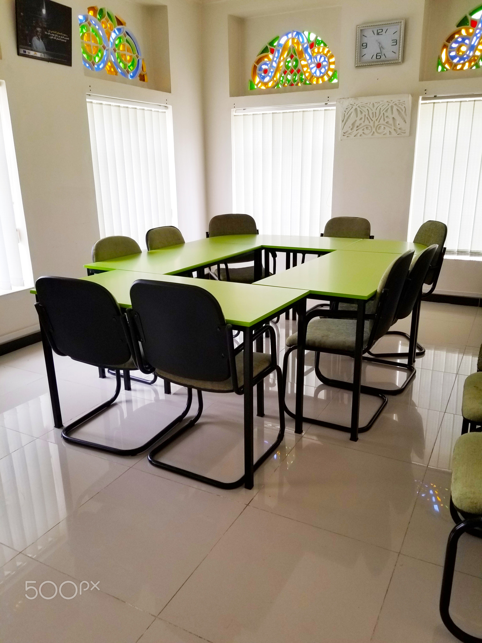 Tables with chairs in a company meeting room