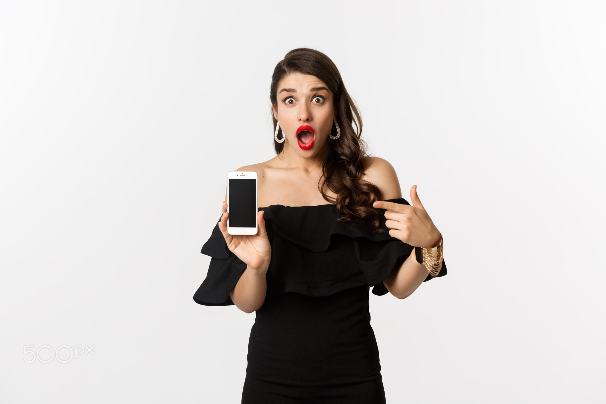 Online shopping concept. Fashionable woman in black dress pointing