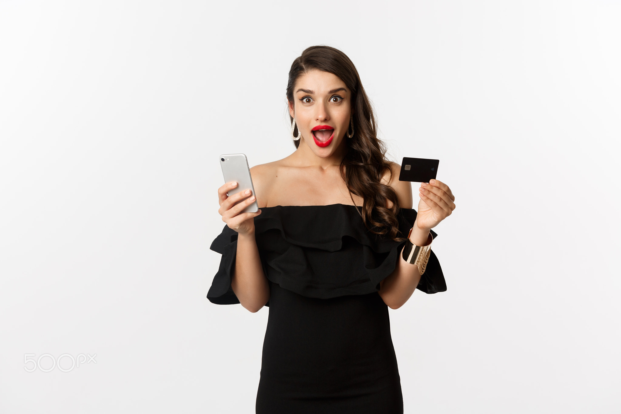 Online shopping concept. Fashionable woman in black dress, holding