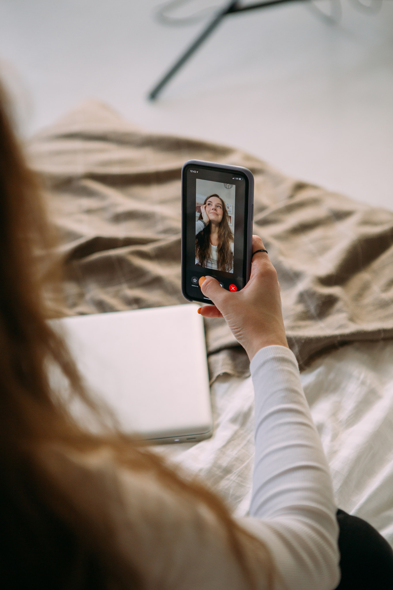 a young woman records a video on the phone