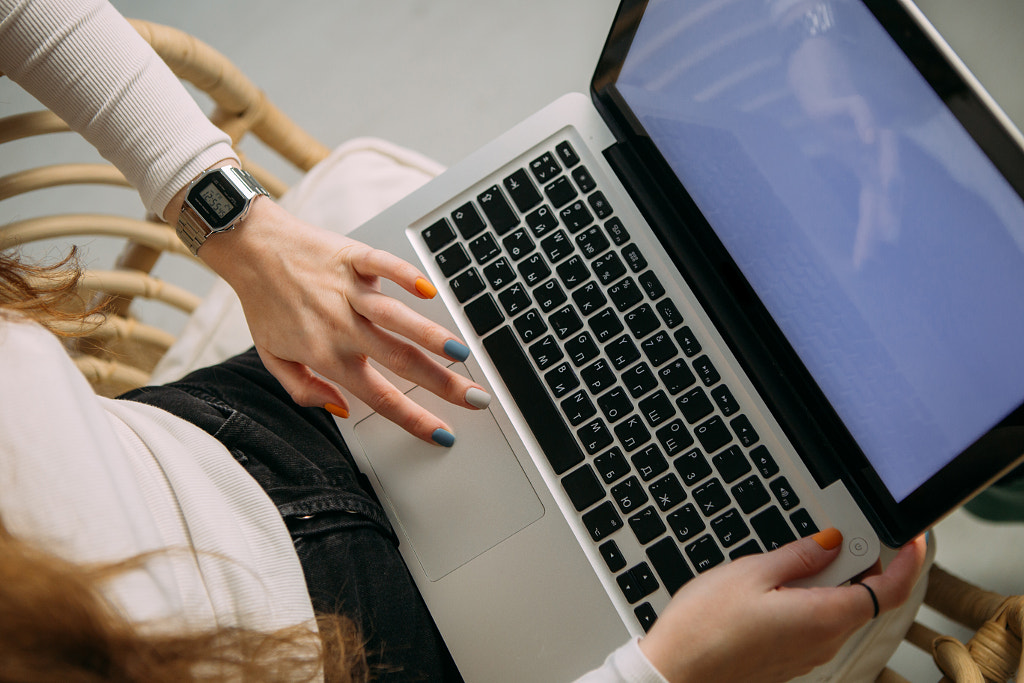  the hands of a white young woman working on a laptop by Alena Spasskaya on 500px.com