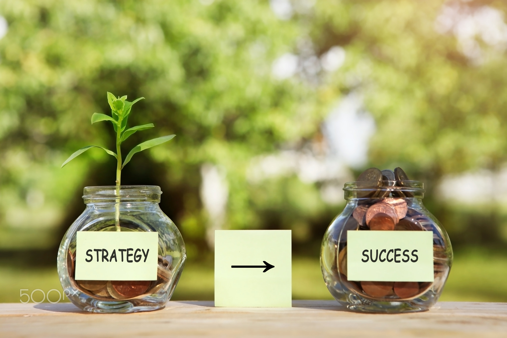 Strategy, success - sticker on a glass jars.