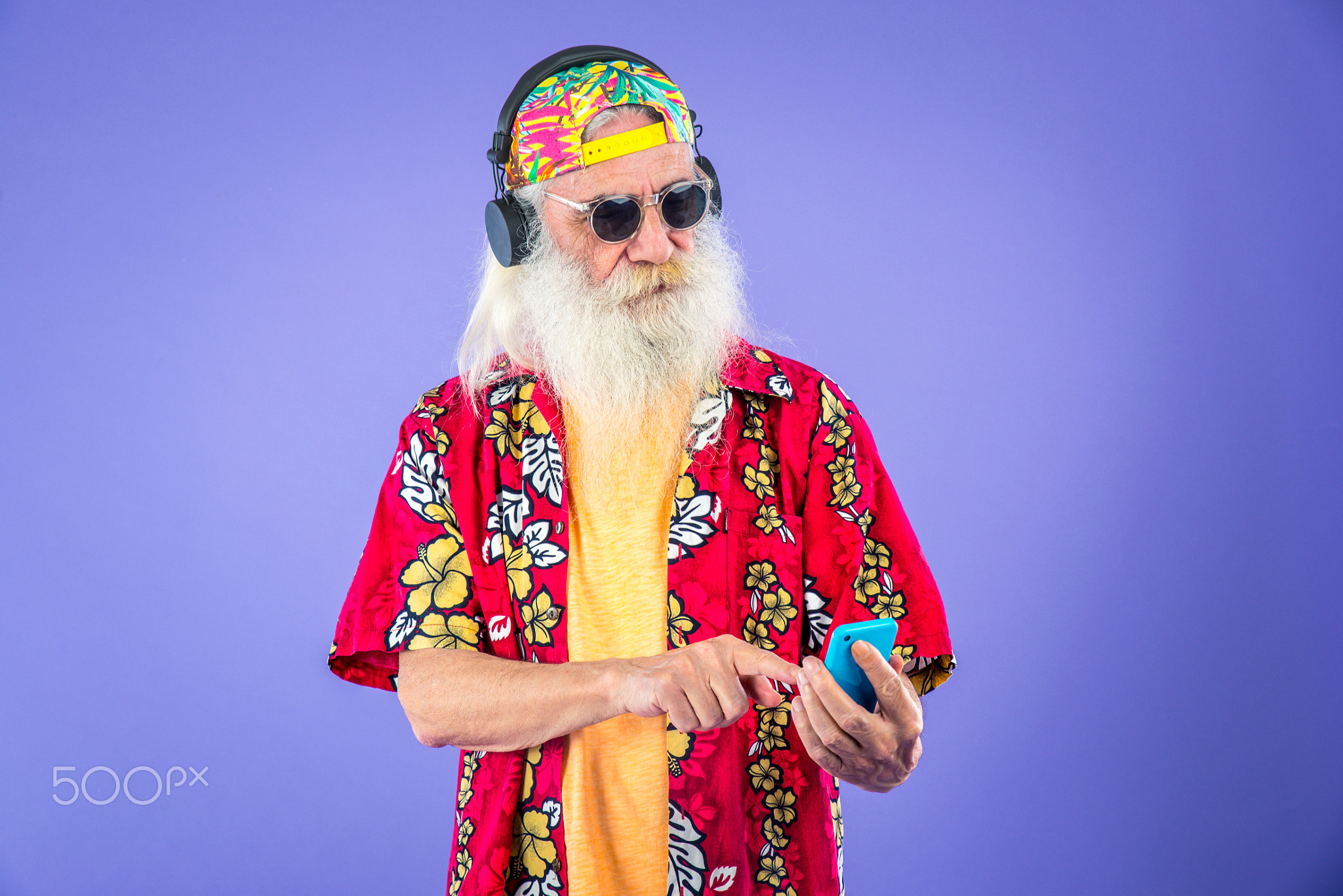 Fashionable grandfather posing with funny clothes.