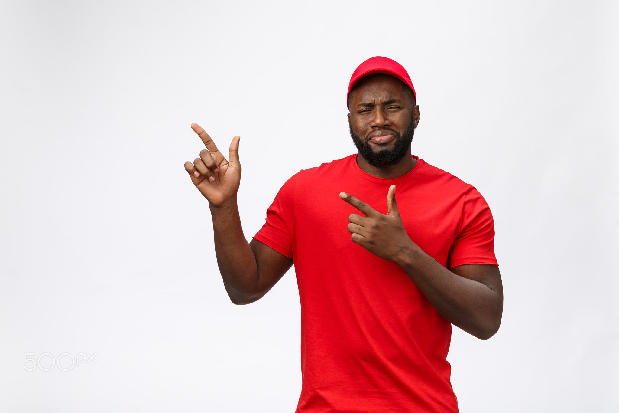 Portrait of handsome african american delivery man annoying pointing