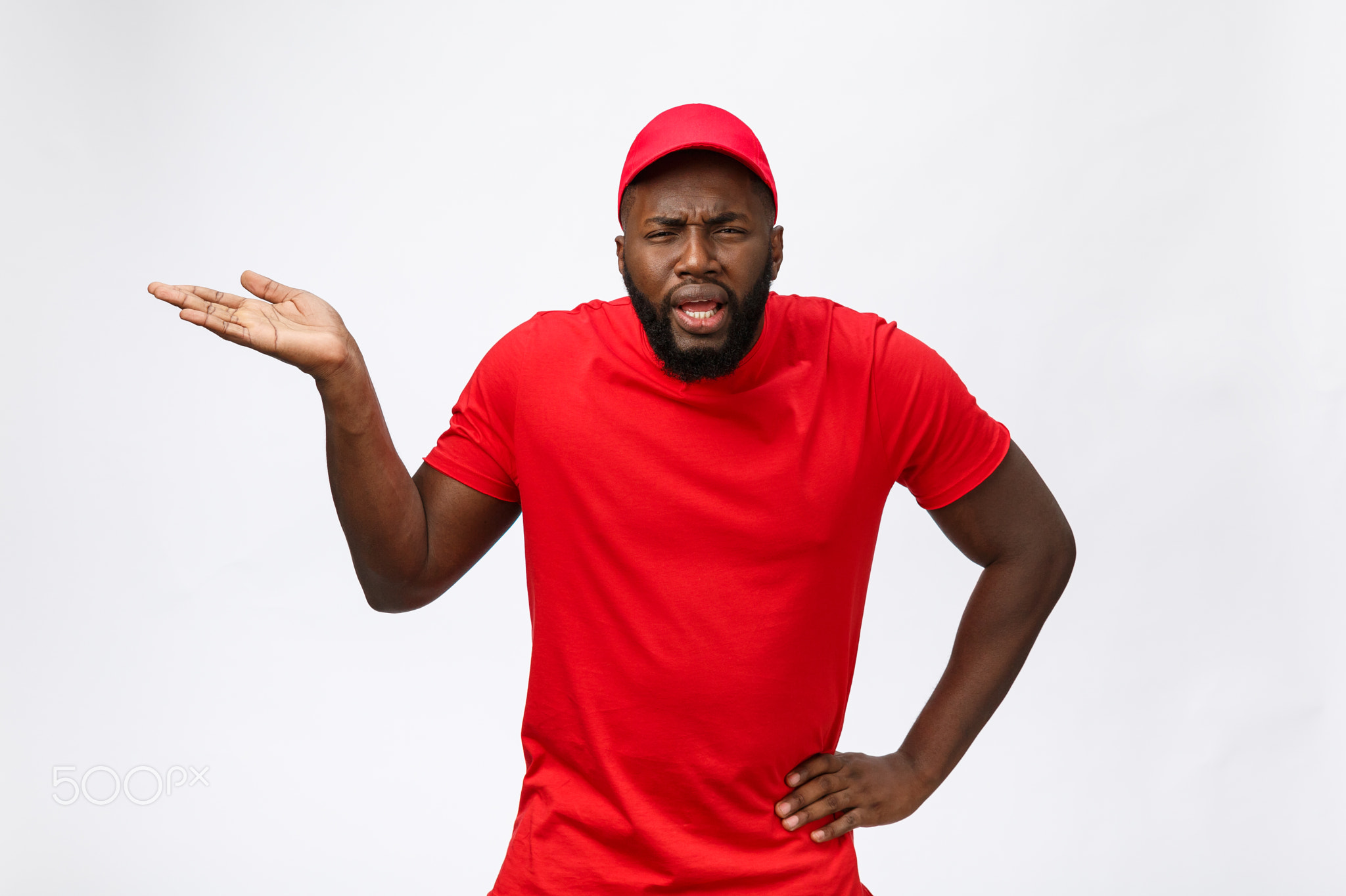 Portrait of handsome african american delivery man annoying pointing