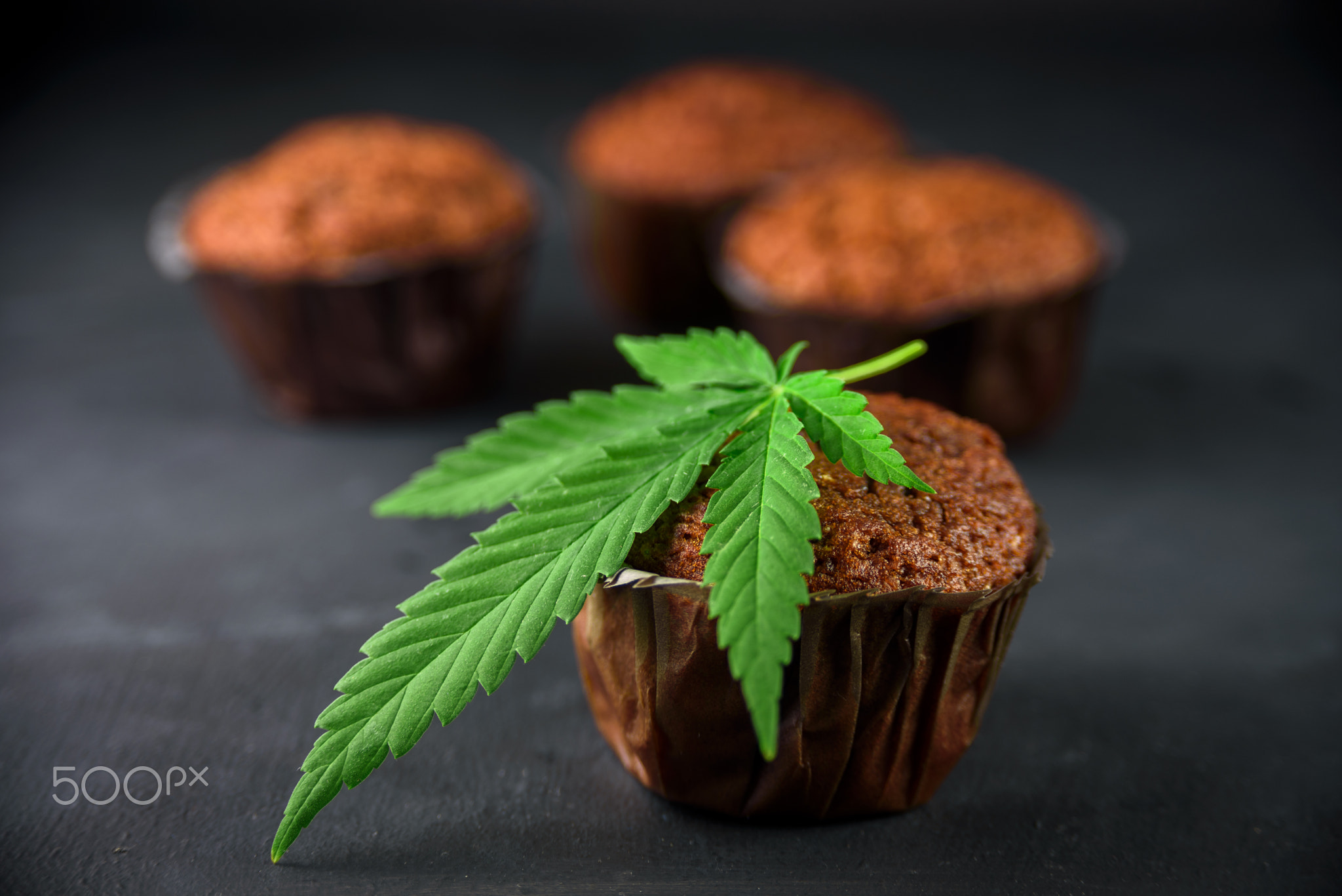 Chocolate muffin with cannabis leaf