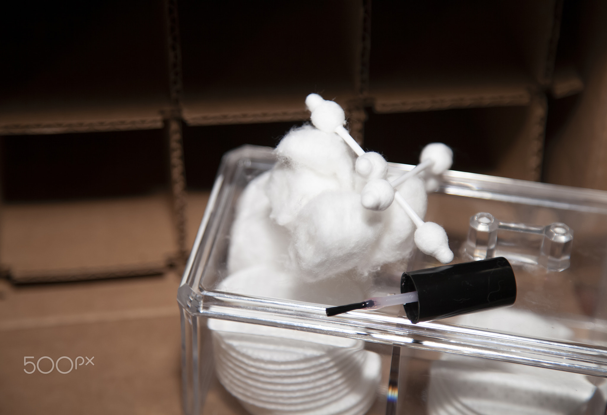 Makeup Cleaner in Front of a Cardboard Background