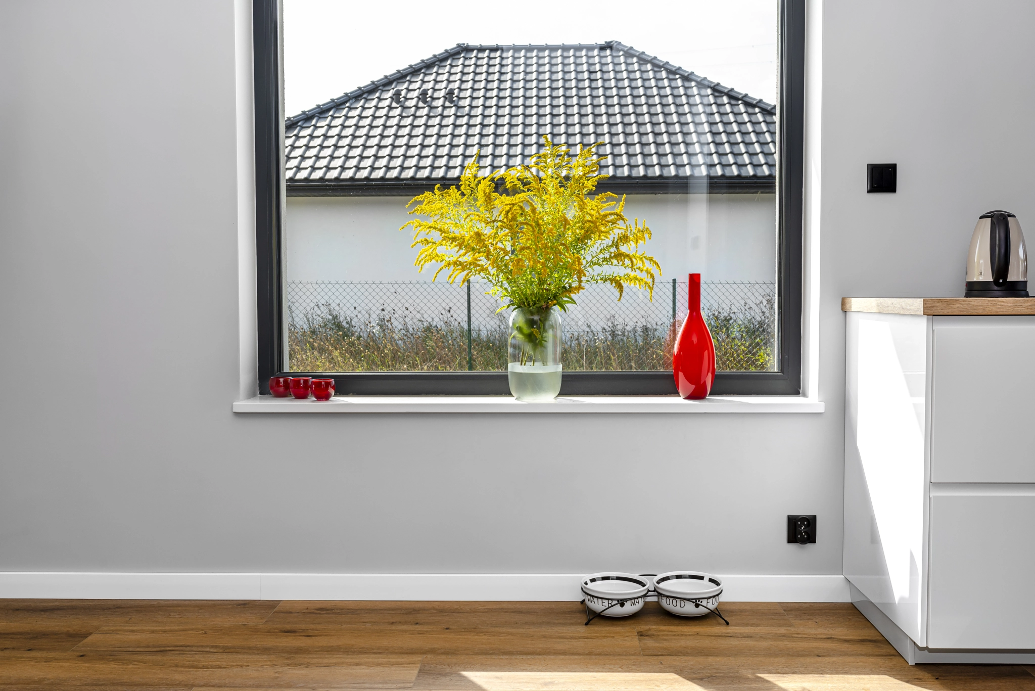 A large window in the dining room connected to the kitchen.