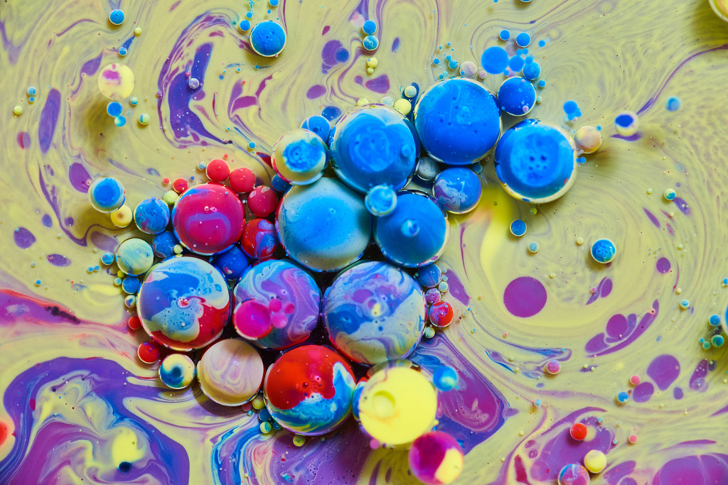 Rainbow spheres on yellow and purple silky surface by Nicholas Klein on 500px.com